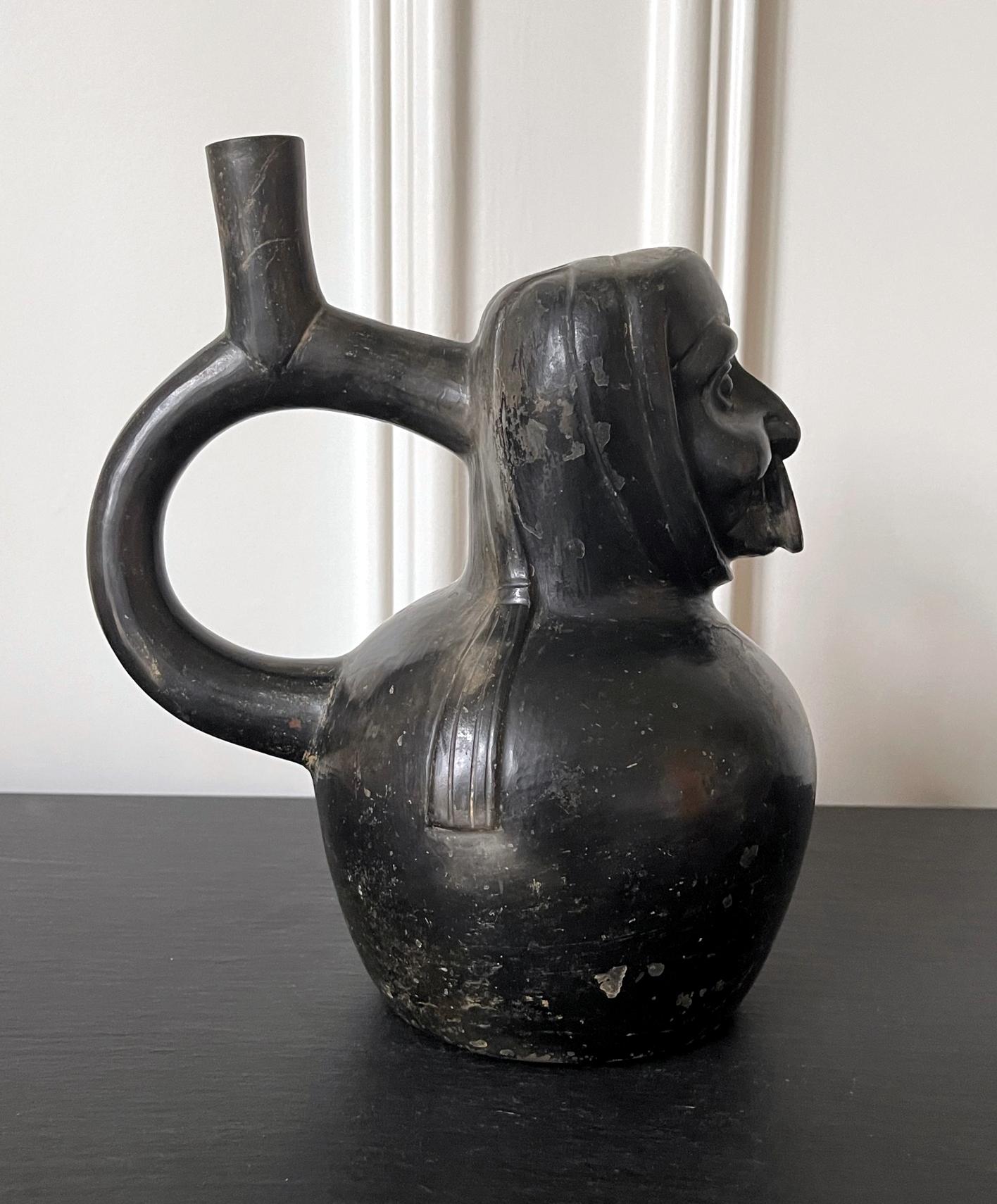 18th Century and Earlier Pre-Columbian Black Portrait Stirrup Vessel from Moche Culture For Sale
