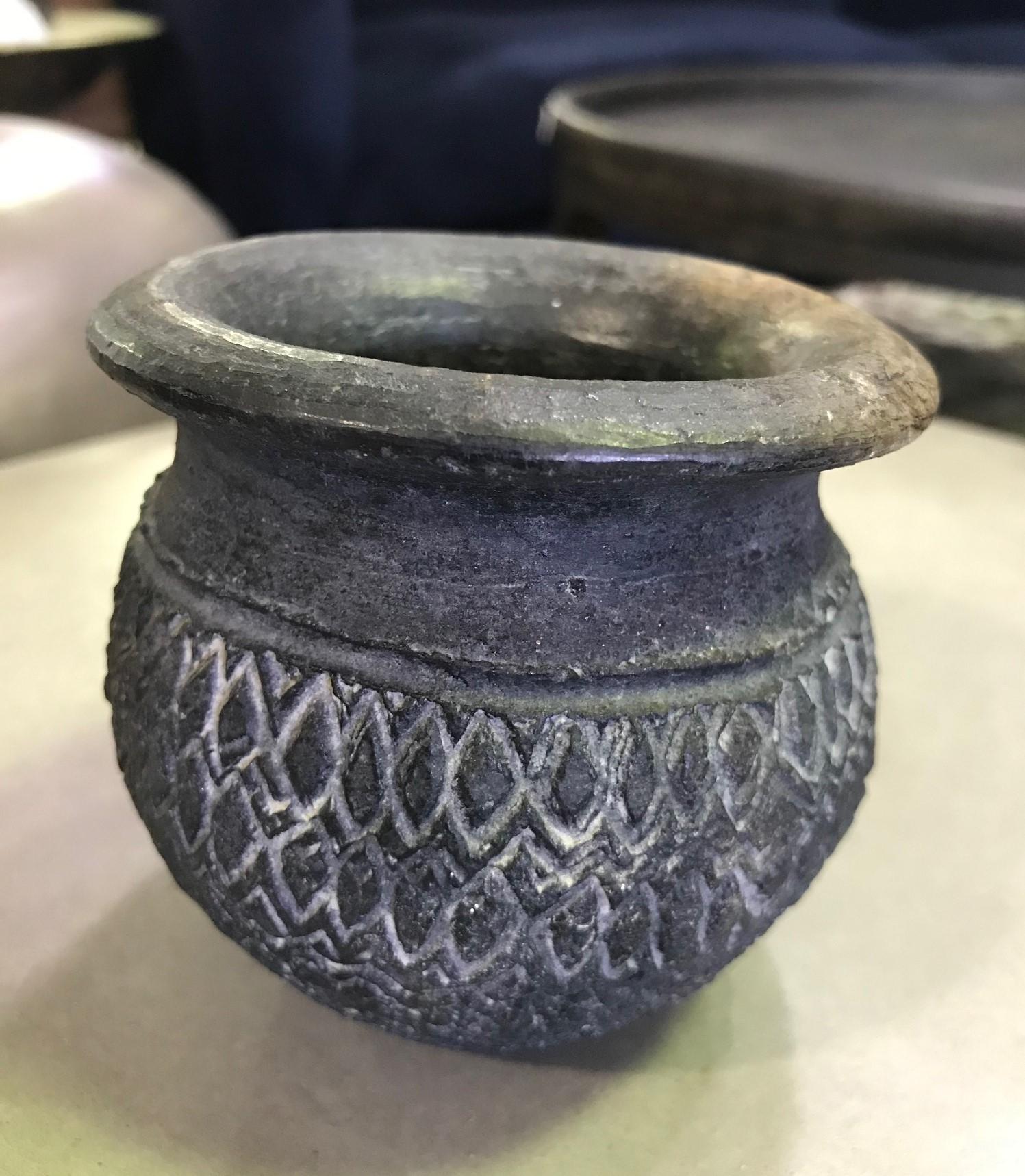 A beautifully designed Pre-Columbian blackware cup or vase or vessel.

Well crafted with a nice patina. Comes from a collection of primitive and tribal artifacts along with three pieces (please see the last two photos).

We are listing as 15th