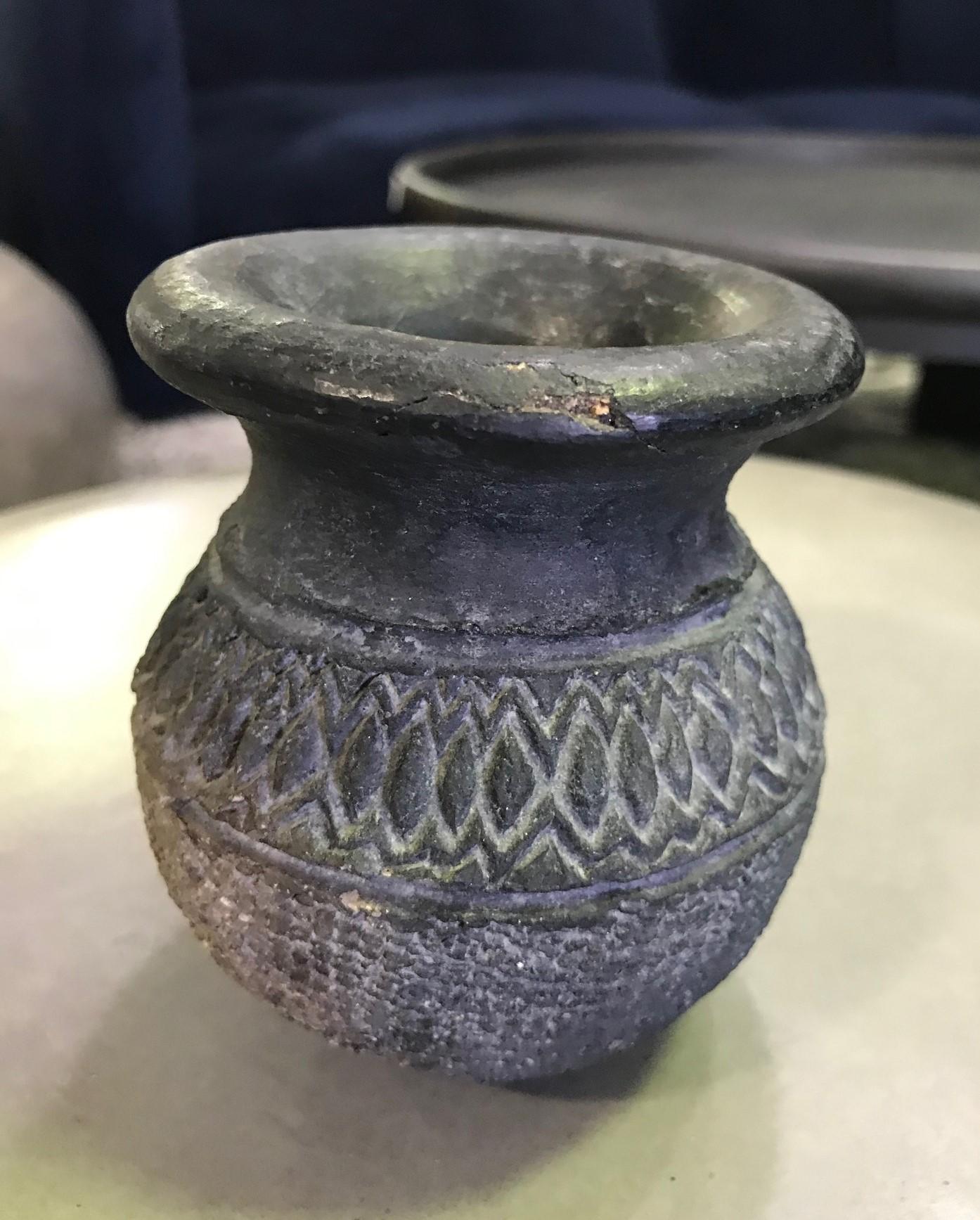 A beautifully designed Pre-Columbian blackware cup or vase/vessel.

Well crafted with a nice patina. Comes from a collection of primitive and tribal artifacts along with three pieces (please see the last two photos).

We are listing as 15th