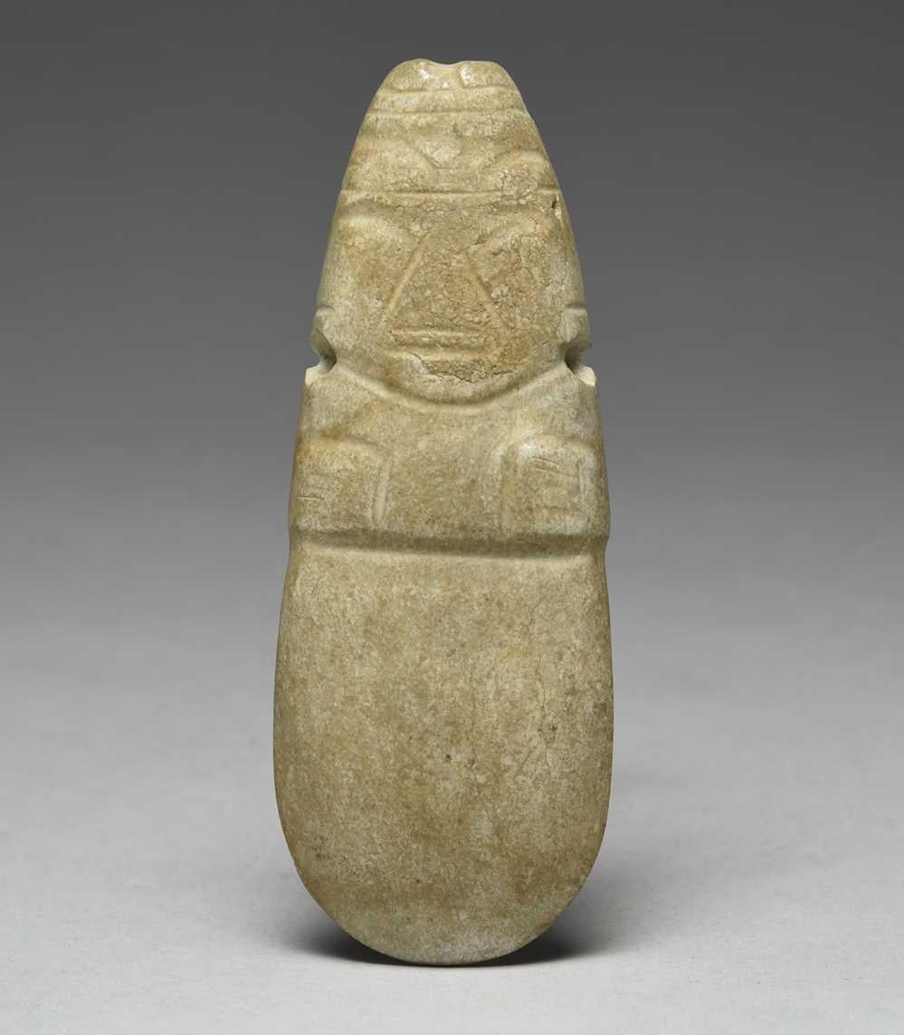  A Pre Columbian Jadeite Axe God pendant from the Guanacaste/Nicoya region of Costa Rica Circa. 800 to 1200 AD.
The axe god pendant of highly stylized Human form drilled through the neck for suspension.
Jade and Jadeite was one of the most precious