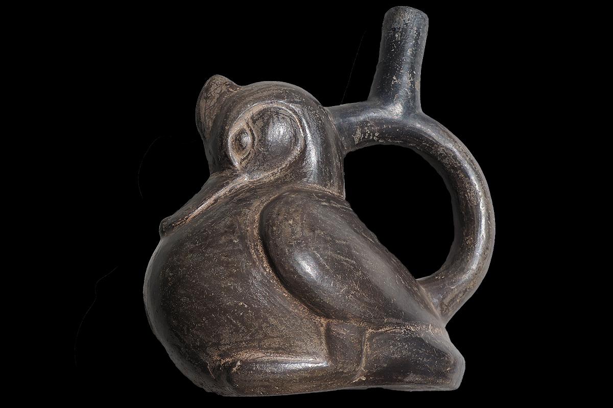The object comes with an international Certificate of Authenticity.

This elegant blackware vessel with its gracefully flared Moche III spout portrays a naturalistic modeled duck with crested head and wings and feet. The excellent workmanship and