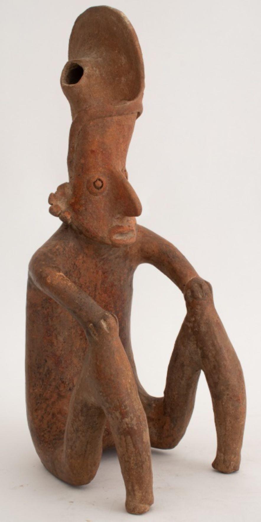 Pre-Columbian Jalisco Seated Figure Ceramic Sculpture, Western Mexico, male figure with headdress, hollow, with faded label to reverse. 14.5