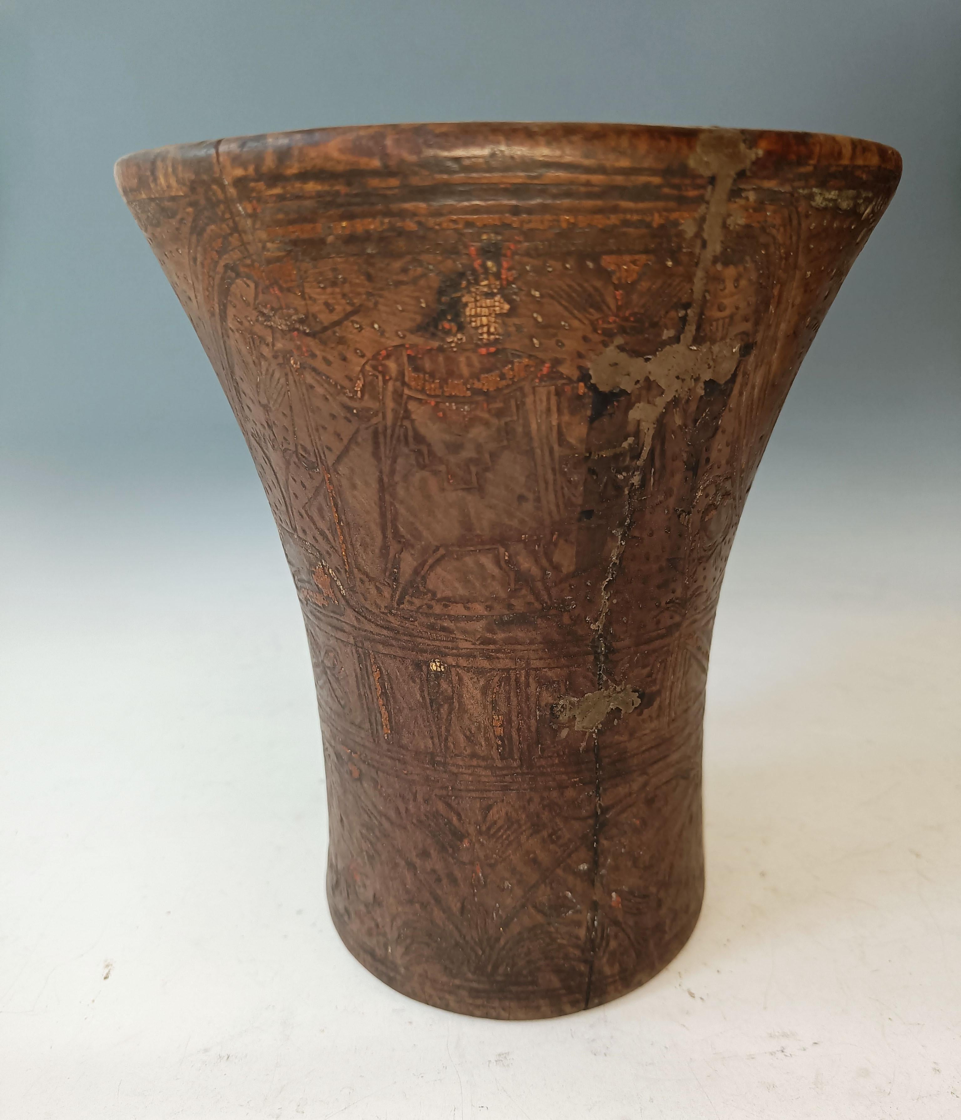 Large Pre Columbian  INCA / Early Colonial period  Wood Kero   
A superb Large Inca Kero cup profusely carved in the mosaic style with a image of the Inca or high ranking Lord with a staff and shield beside a  Puma, Humming birds feeding on  flowers
