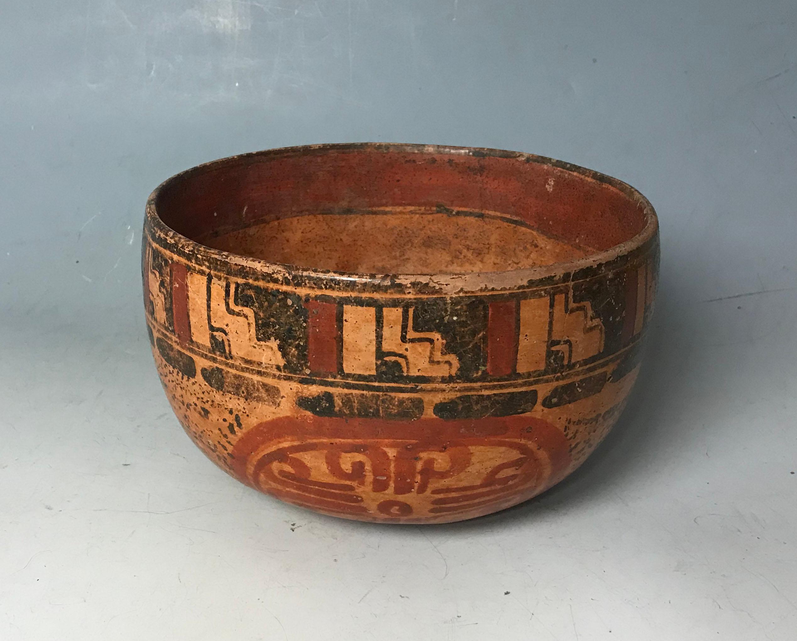 An impressive Mayan Poly-chrome painted ceremonial pottery bowl
Guatemala/ central America late Classic period, circa A.D. 550-950,

A beautiful bowl of rounded beep circular form, the outer rim painted with a temple step motive the lower section