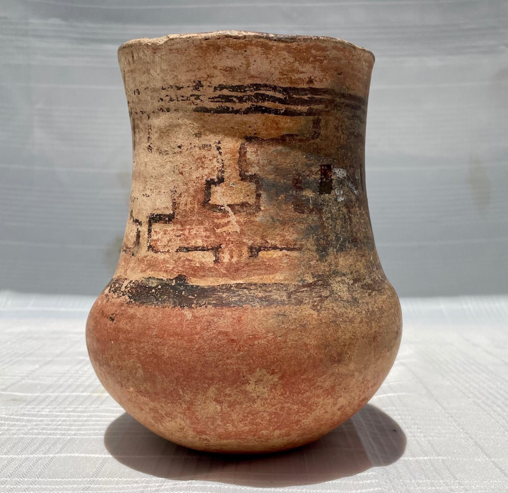 Pre-Columbian Mayan terracotta vessel with Glyphs.

A fine, well-made terra-cotta Pre-Columbian Mayan, Mexican vessel in cylindrical vase form with bulbous bottom. The beautiful thin-walled vessel stands on a flat base. Banding black glyphs