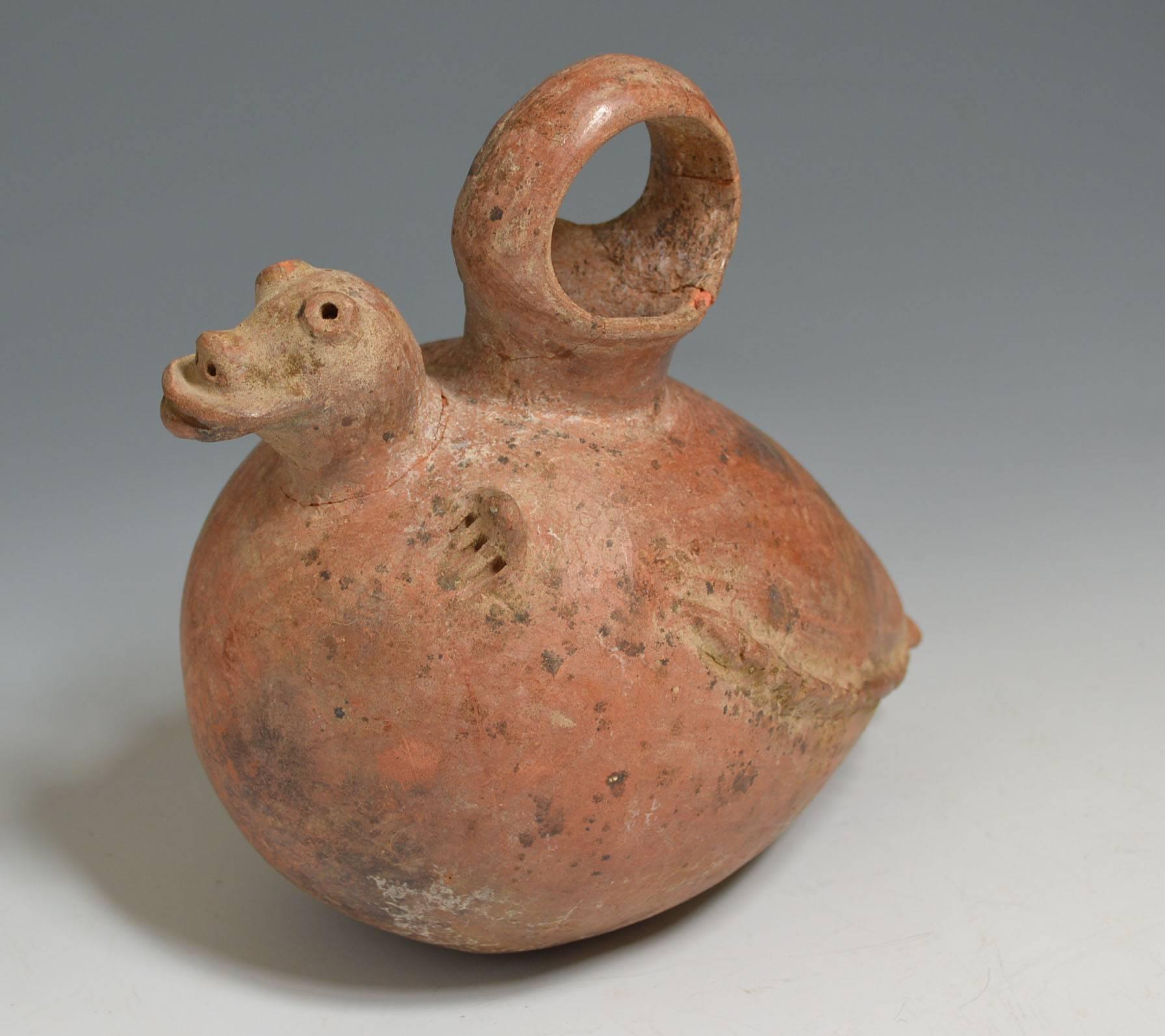 Pre Columbian rare Calima vessel Colombia ancient South America 
A Calima vessel featuring a reptile emerging from a egg
Red clay with black negative resist
Calima culture circa 200 BC-400 AD Columbia
Condition minor hairline crack on neck, no
