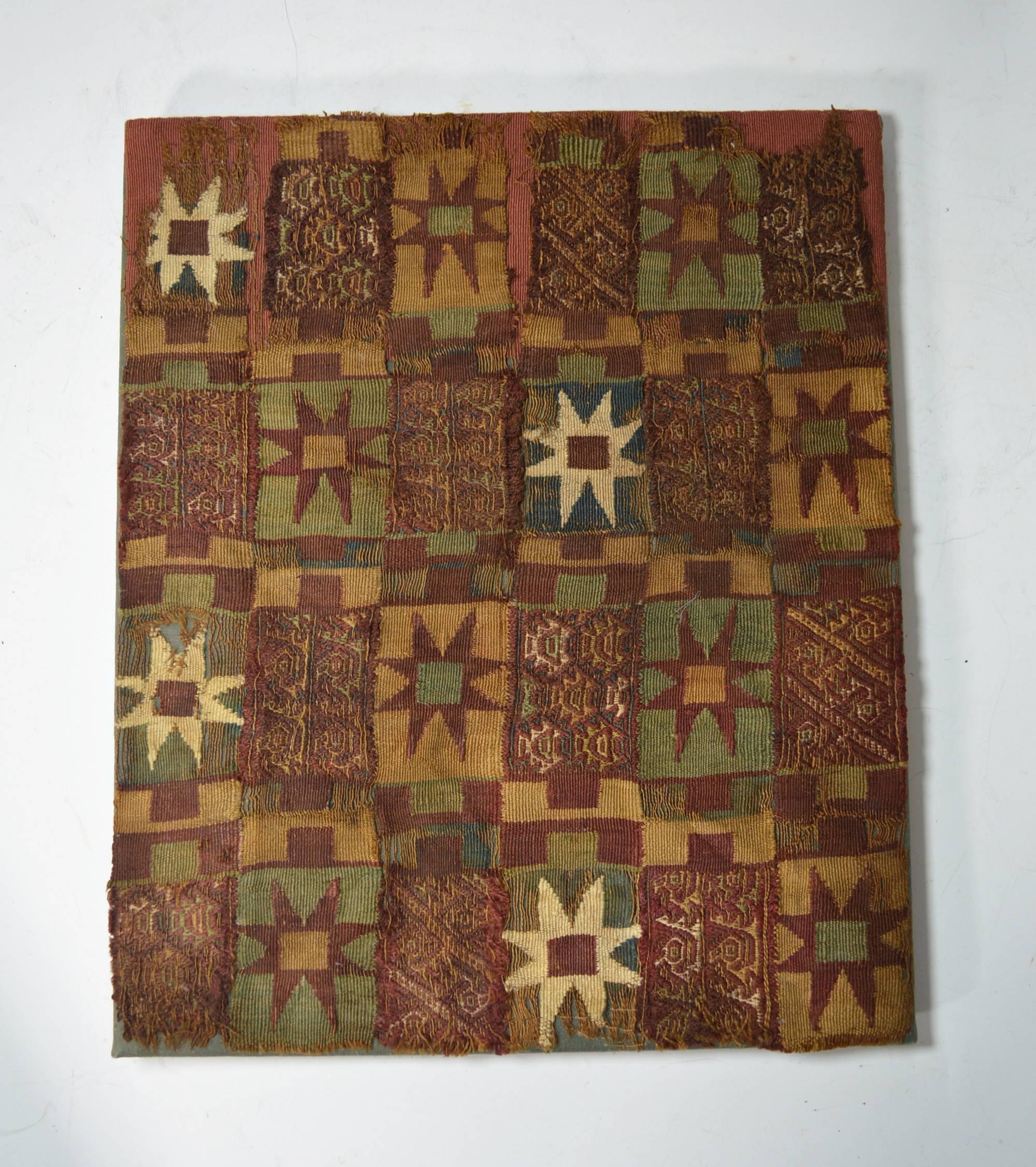 Pre-Columbian art.
A rare Inca textile fragment panel ancient South America.
The textile finely woven with multi color star motives interspersed with piranha fish, birds and animals in bands of red,
probably from a tunic or manta cloth
Inca period,