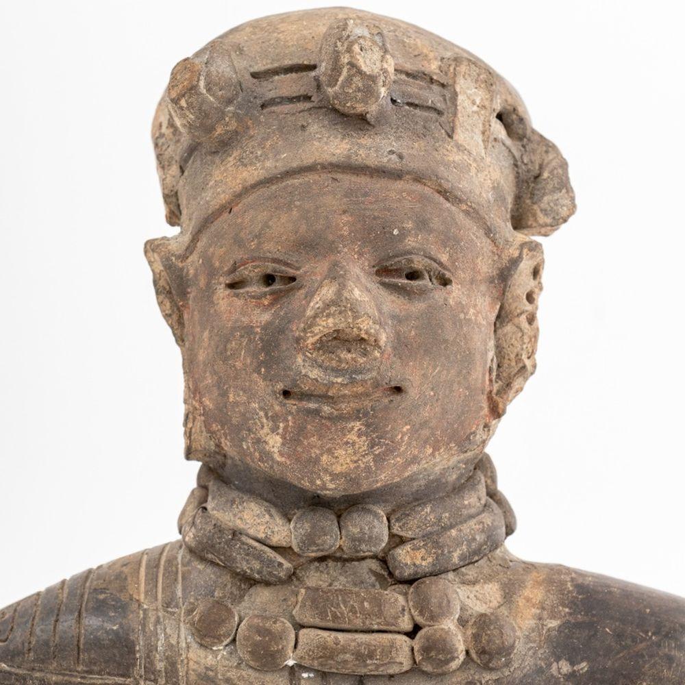 Pre-Columbian Standing Male Nude Figure, probably Aztec, black burnished terracotta, mounted on ebonized wood base. 14.5