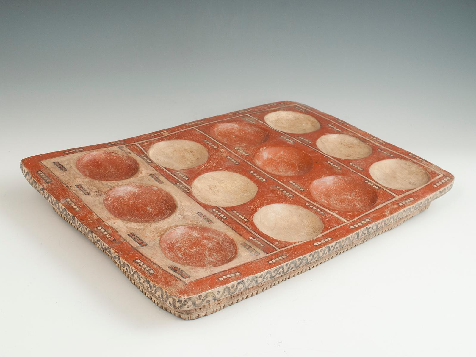 Pre-Columbian Terracotta game board or tablet, Chachapoyas, Northern Peru

This is a rare game board or tablet from the pre-Incan Chachapoyas culture of Northern Peru. Its use is mysterious, and its graphic appeal is immediate.
Measures: 13