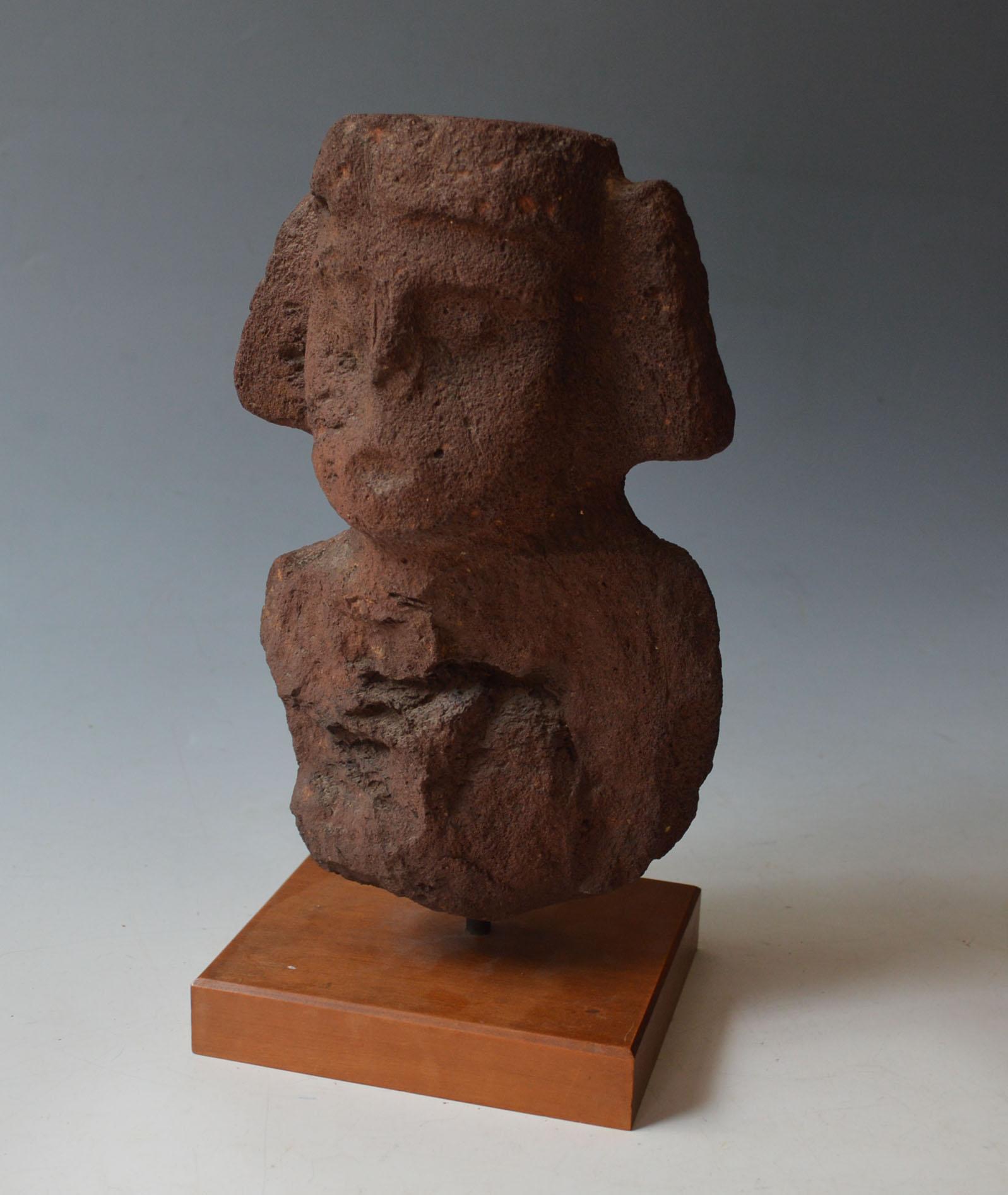 Pre Columbian Totonac stone bust Figure 
Veracruz Mexico Circa  600-900 A.D


A Rare basalt bust of a Totonac deity with pouted lips and geometric headdress, caved in basalt with dark red pigments  
Measures:  Height 27 cm   
Condition: Good  
Ex UK