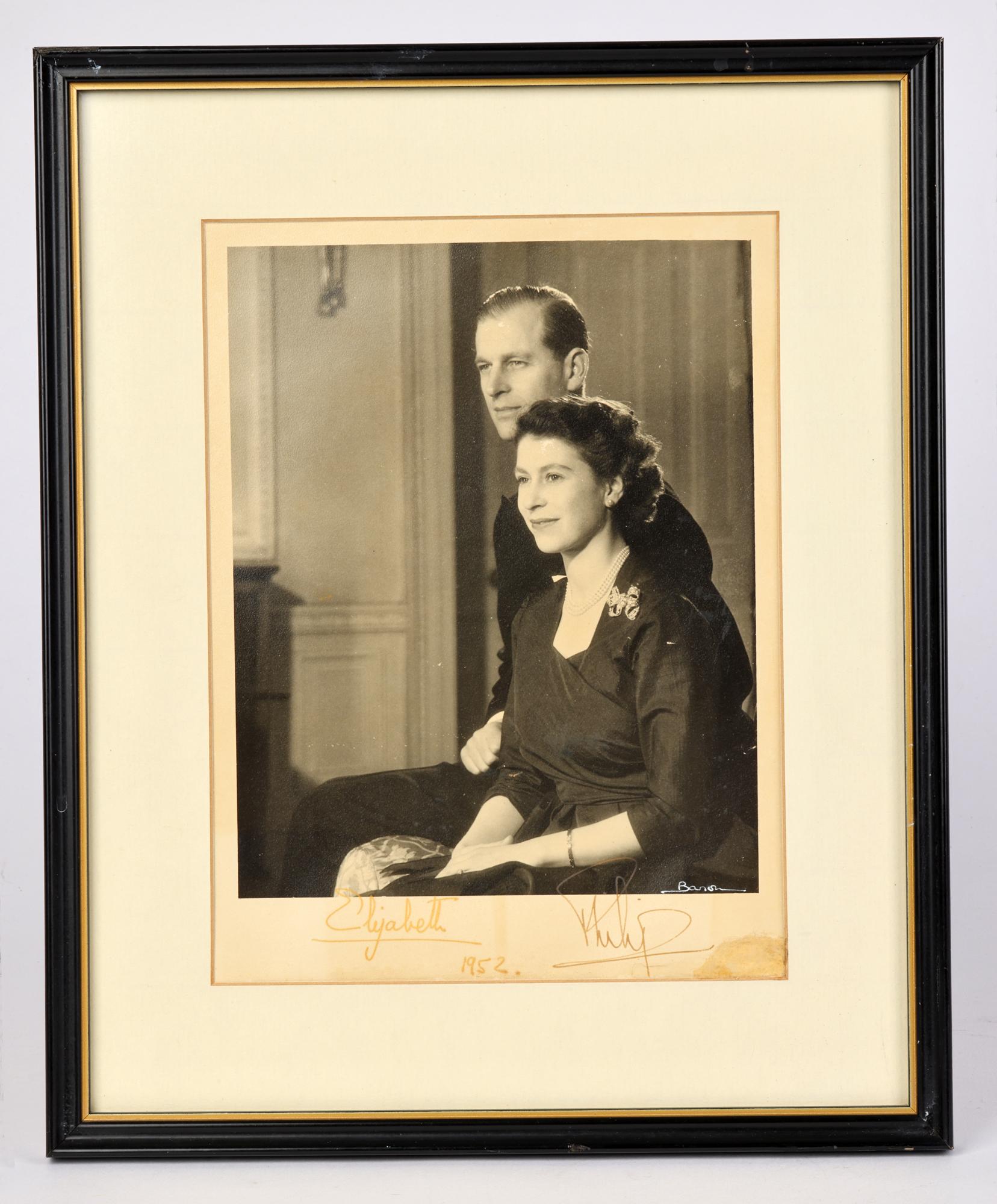 A rare signed framed pre-Coronation black and white photograph of Princess Elizabeth together with Prince Philip by Sterling Henry Nahum (signed Baron) (1906-1956) dated 1952. The finely composed silver albumen portrait portrays Princess Elizabeth