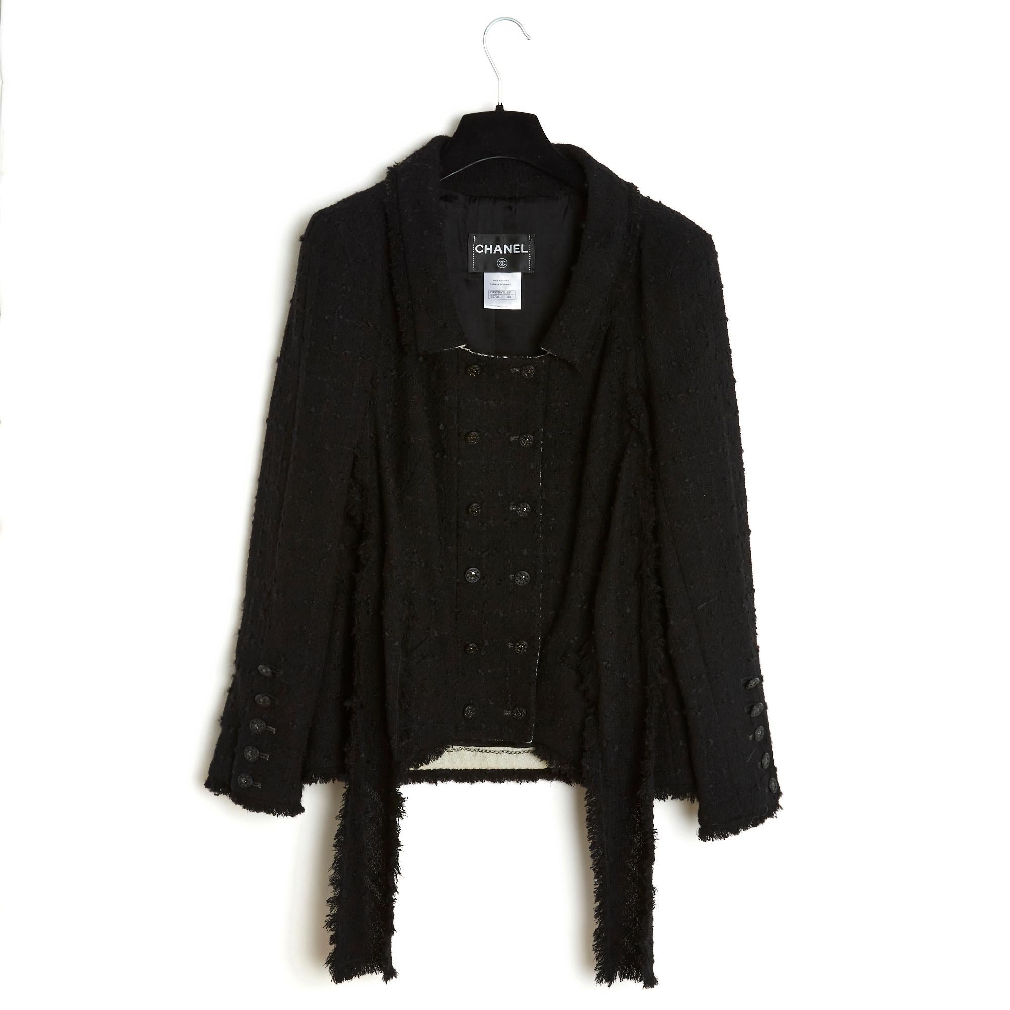 Chanel jacket Métiers d'Art Paris Moscow or Pre Fall 2009 collection in black wool blend tweed with a wide belt to tie in the front, or in the back (or not at all ;-), simple enlarged collar, cross closure in front with 2 rows of 6 jeweled buttons,