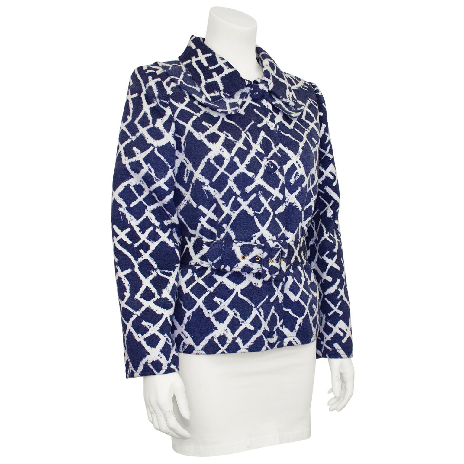 Lovely Oscar de la Renta jacket from the pre fall 2011 collection. Navy blue with all over abstract white 'x' pattern. Unique layered double collar detail and snap buttons down the centre. Strong shoulders with interior shoulder pad. Can be worn