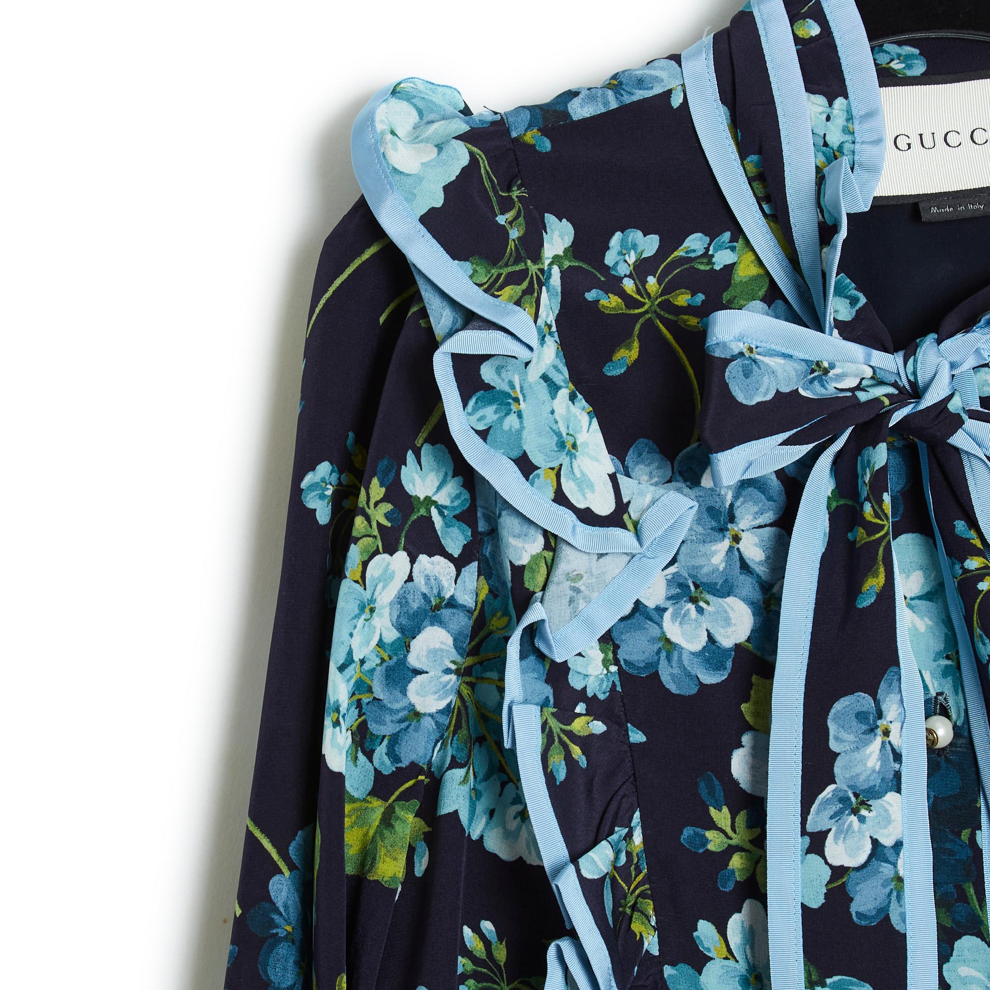 Gucci dress Pre fall 2016 collection (by Alessandro Michele) in light navy blue evening crepe (almost black) printed floral pattern in shades of sky blue, ruffles and details trimmed with sky blue silk ribbon also, high collar with lavaliere, closed