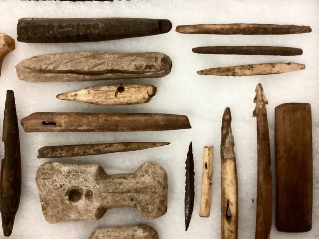 A curated collection of Pre Inuit Thule Culture (1,200-1,600 A.D.) Artifacts housed in a Museum Style Frame. The Collection includes various implements used in daily life by the wide ranging Thule People including Adze Handle Fragments, Awls for