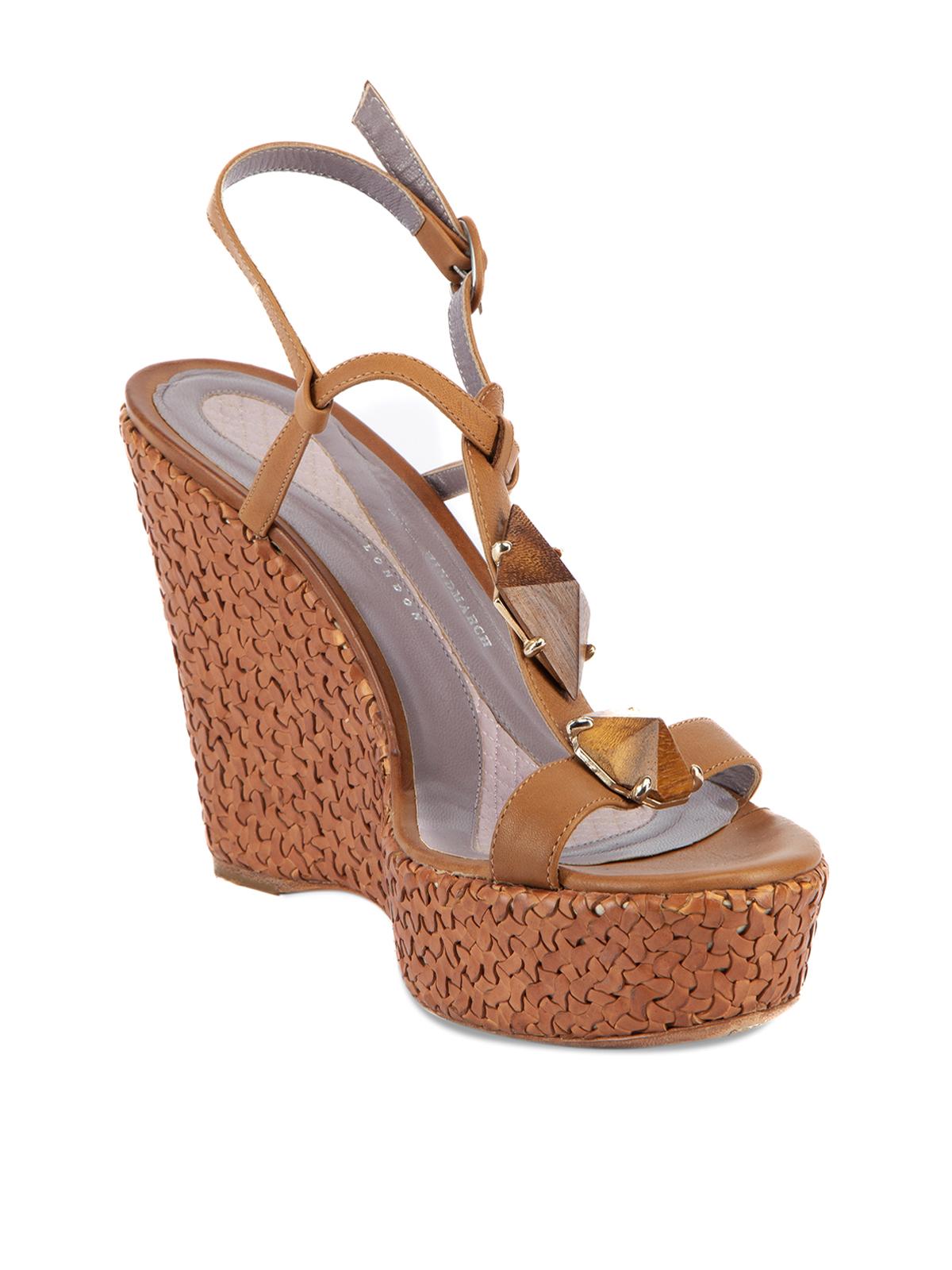 CONDITION is Very good. Minimal wear to shoes is evient. Light fraying along strap, wear to soles on this used Anya Hindmarch designer resale item. Details Brown Leather Sandals Peep almond toe Wedge platform heel Woven wedge design T strap Ankle