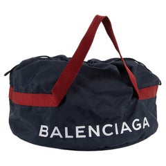 Pre-Loved Balenciaga Women's Navy & Red Drawstring Logo Weekend Bag