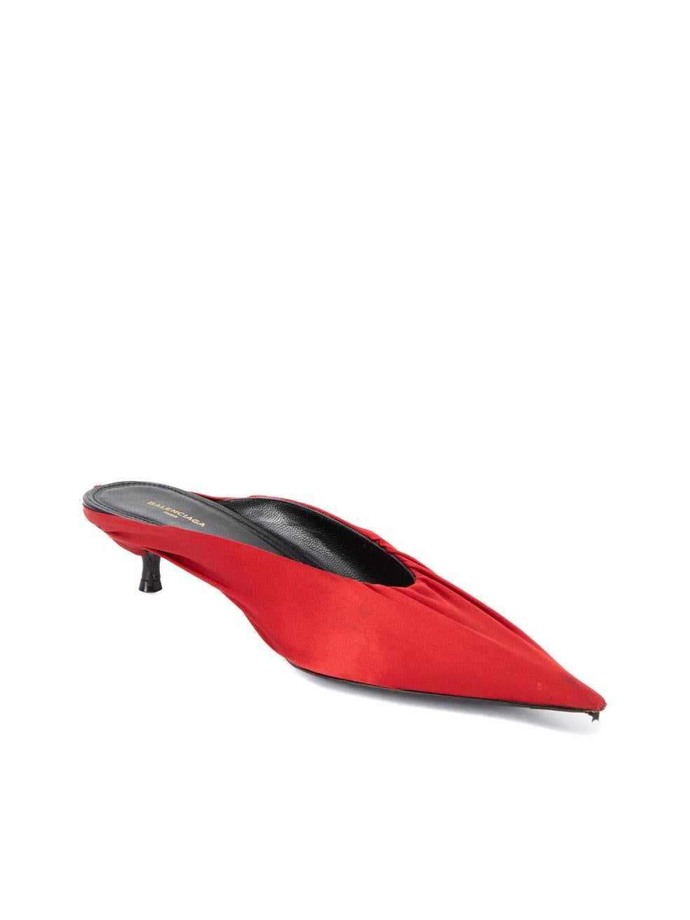 CONDITION is Very good. Minimal wear to mules is evident. Minimal wear to exterior satin material on the heel tip where peeling and stain can be seen on this used Balenciaga designer resale item. Details Red Satin Mules Slip on Pointed toe Kitten