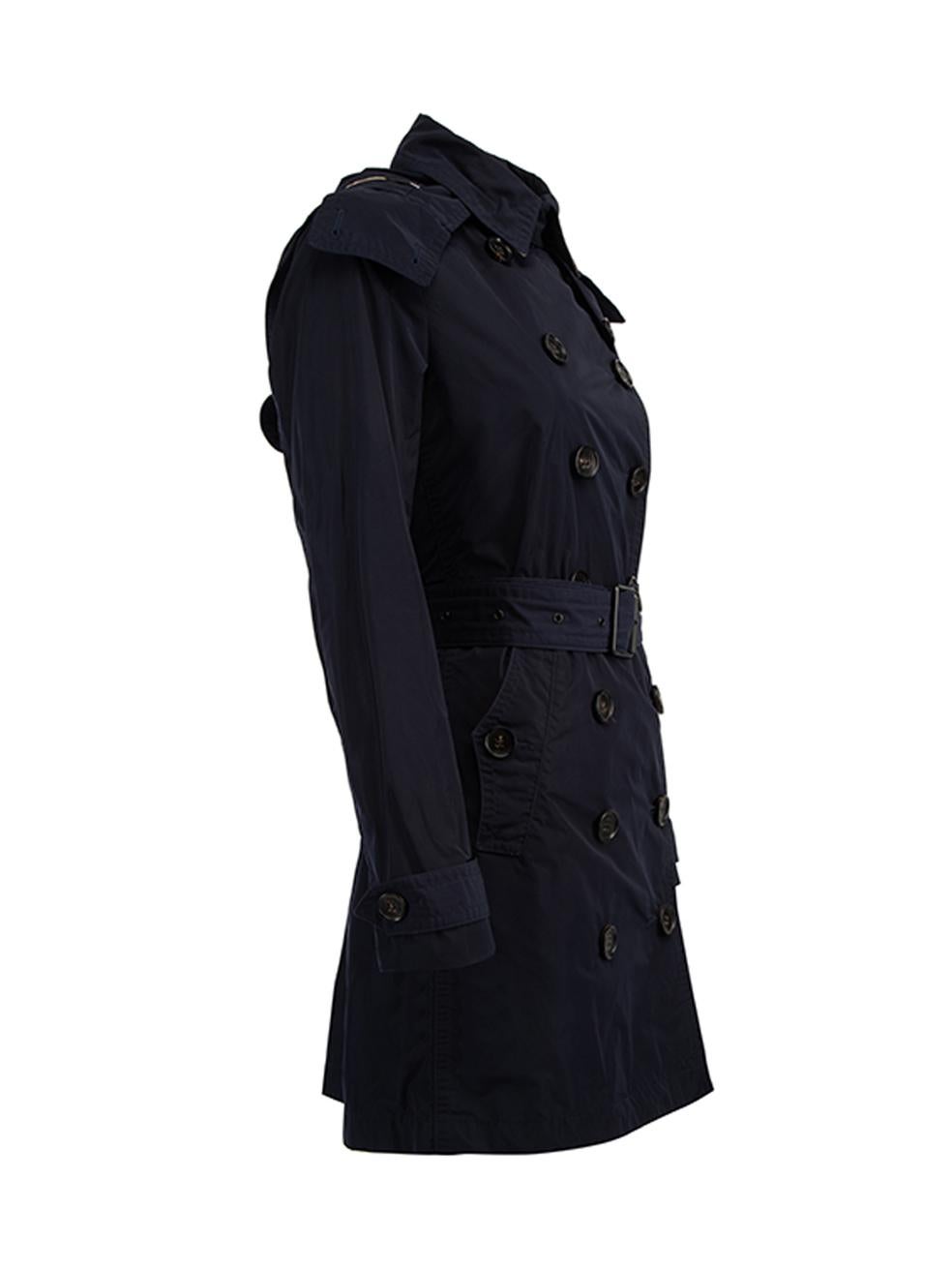 CONDITION is Very good. Minimal wear to jacket is evident. Minimal wear to the outer polyester fabric on this used Burberry Brit designer resale item. This item includes a garment bag. Details Navy Polyester Double breasted trench coat Buttoned