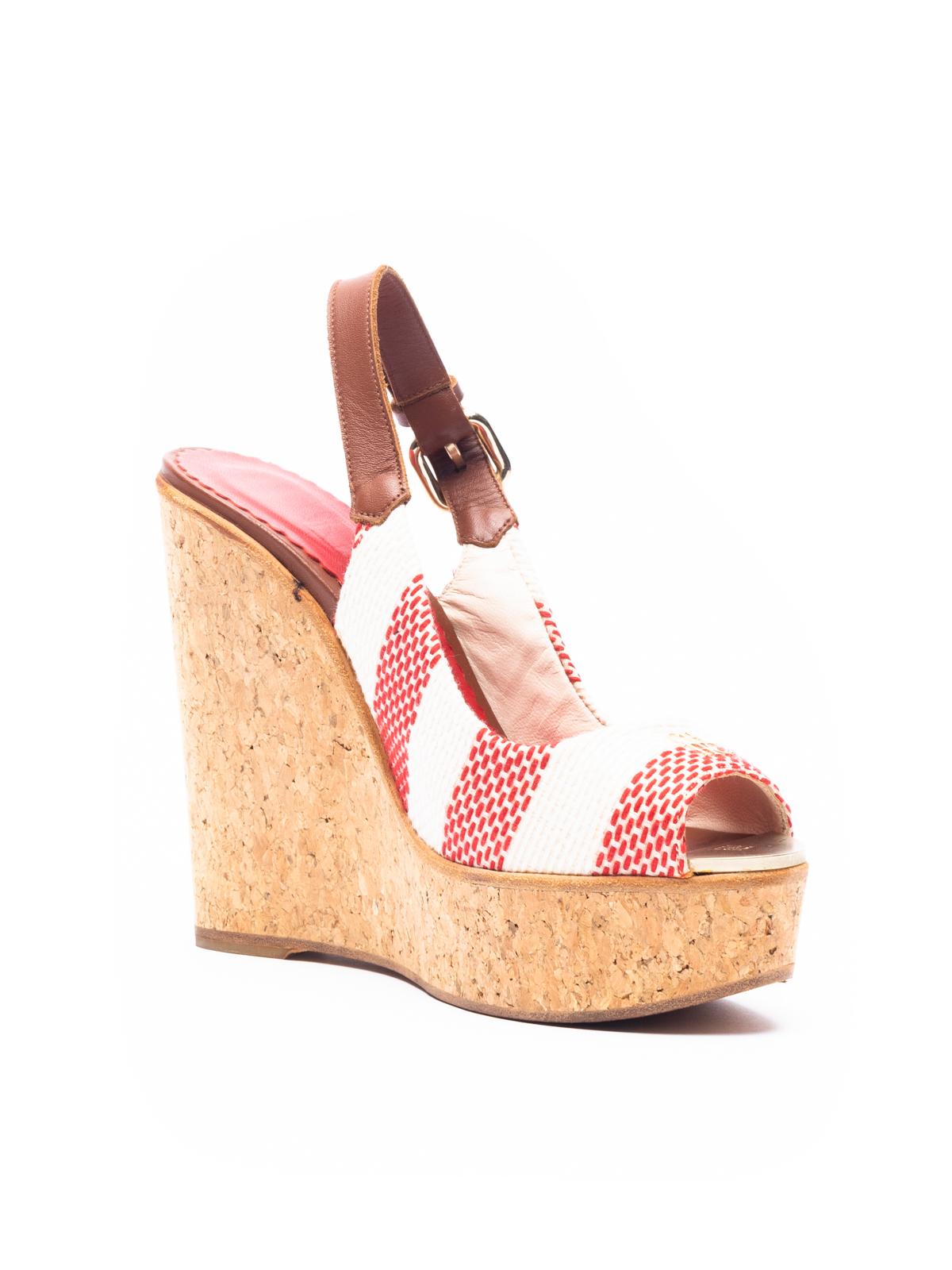 CONDITION is good. There is minor wear to the inner and outer soles, as well as light wear ot the canvas exterior. Details Red and Cream Cork wedge Slingback and adjustable buckle Composition Canvas, leather and cork Fitting Information Fits true to