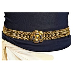 Pre-loved Chanel golden belt with Camellia