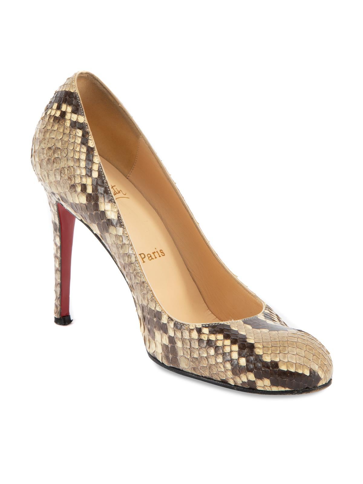CONDITION is Very good. Minimal wear to heels is evident. Minimal wear to the outsole and heel tip. There are also minimal loose threads around the shoe rim on this used Christian Louboutin designer resale item. Details Beige Exotic leather- Real