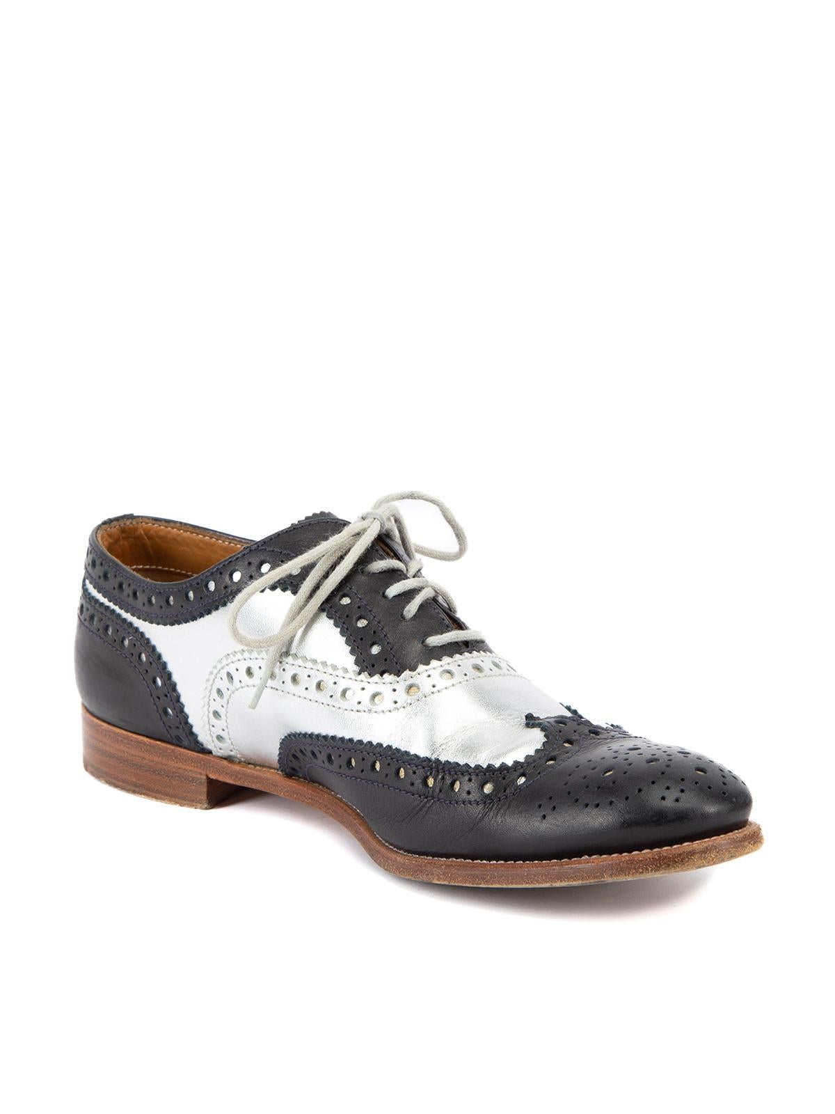 CONDITION is Good. Minor wear to brogues is evident. Light wear to the outsole and leather exterior where cresing and scuffs can be seen on this used Churchs designer resale item. Details Black and silver Leather Lace up Oxford Almond toe Flat heel