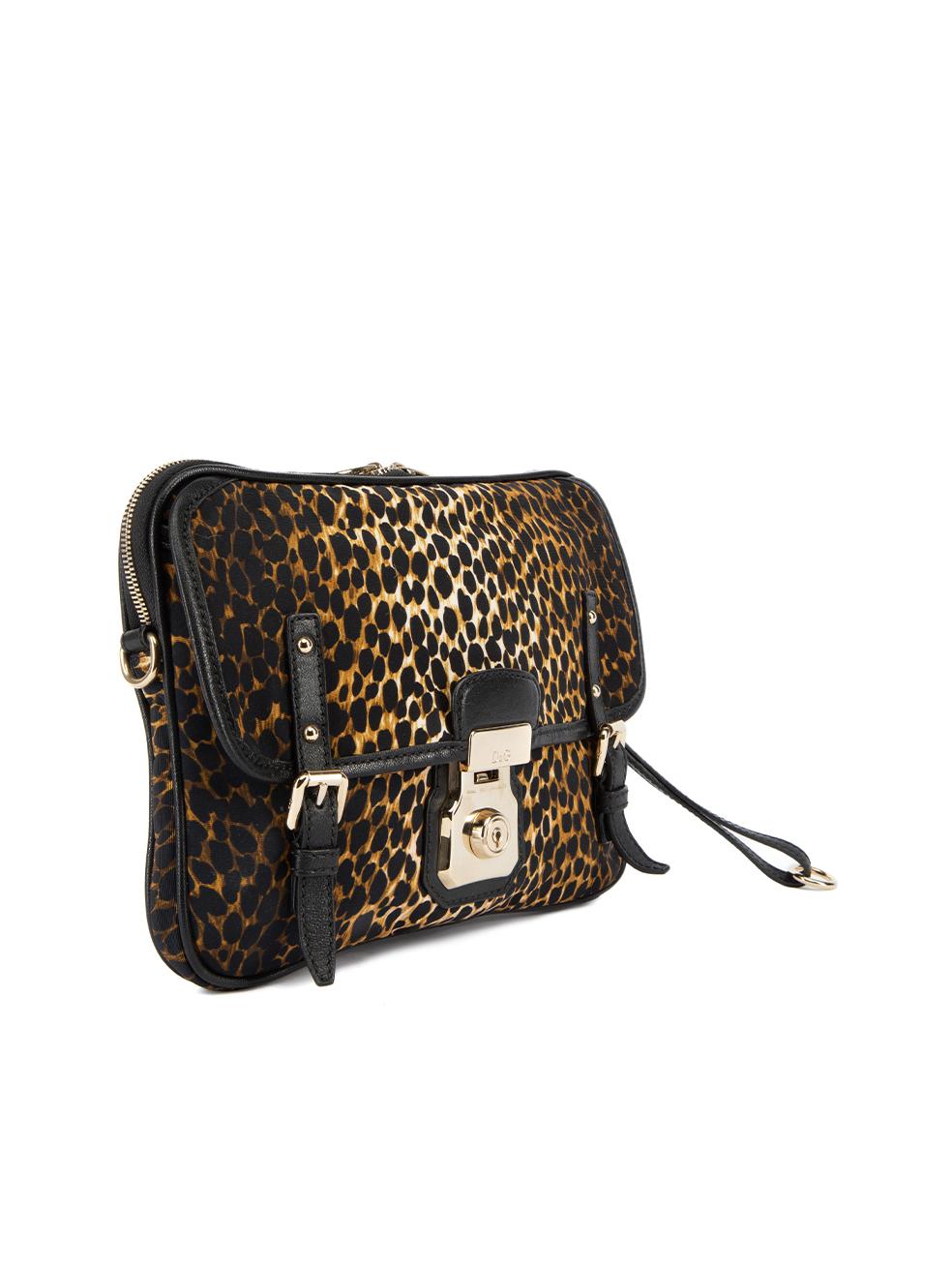 CONDITION is Very Good. Minimal wear to clutch is evident, minimal scratches can be seen logo plaque on this used Dolce & Gabbana designer resale item. Details Brown Canvas Large clutch Leopard print Two main compartment Push lock clasp and buckle