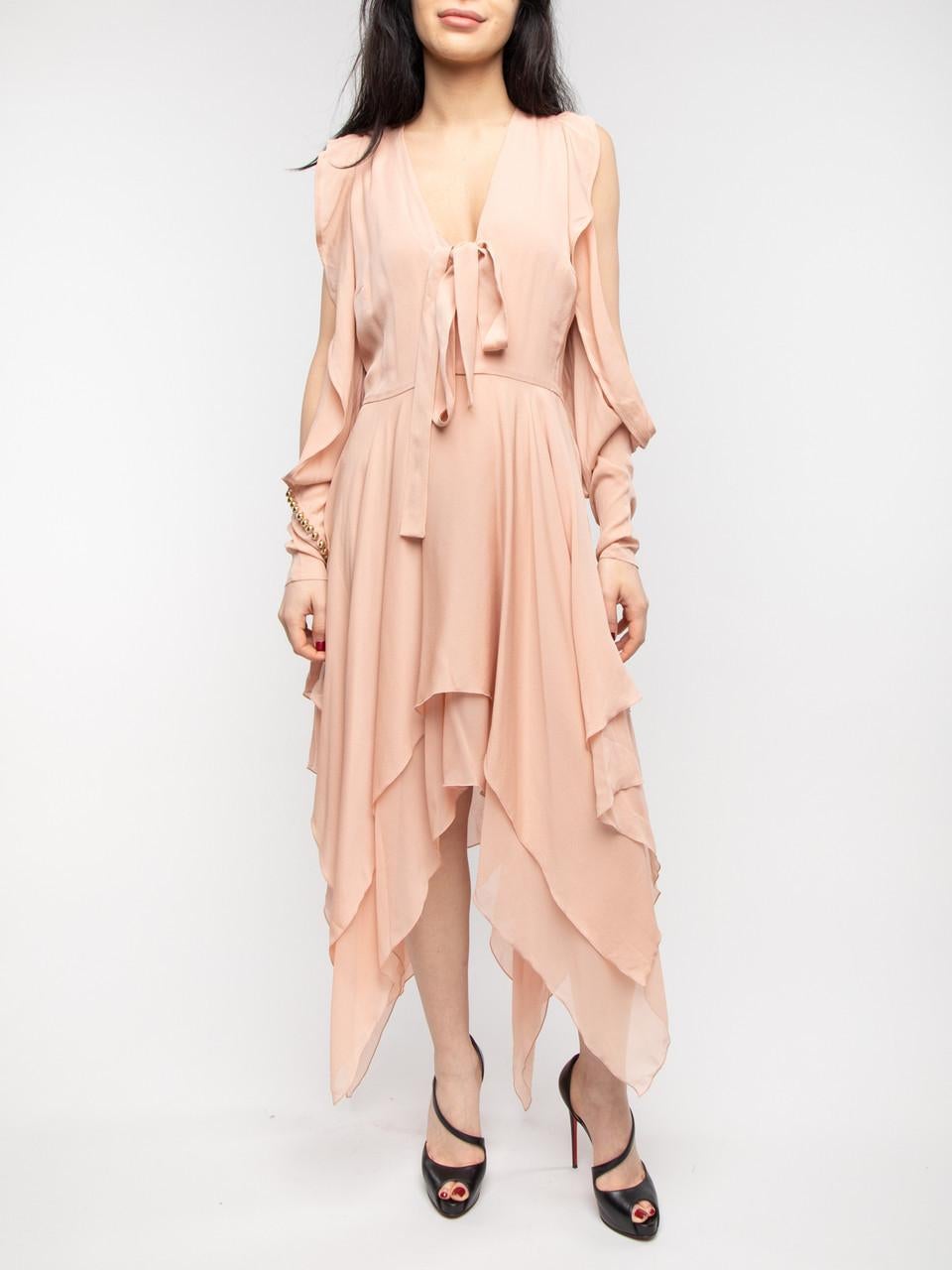CONDITION is Good. Some wear and pilling to dress is evident. Slightly visible stains, some loose threads, damaged clothing labelon this used Elie Saab designer resale item. Details Pink Silk Assymetric Loose fit Long sleeves with ruffles & cut out