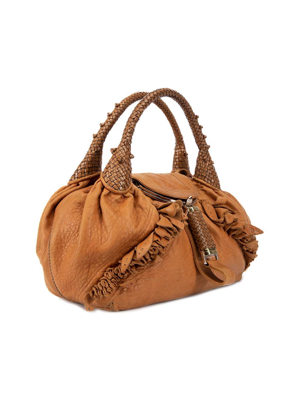 CONDITION is Good. Minor wear to bag is evident. Light wear to the leather exterior which is discoloured, worn down in certain areas and there is a small rip at the bottom of bag on this used Fendi designer resale item. Details Tan Leather Large top