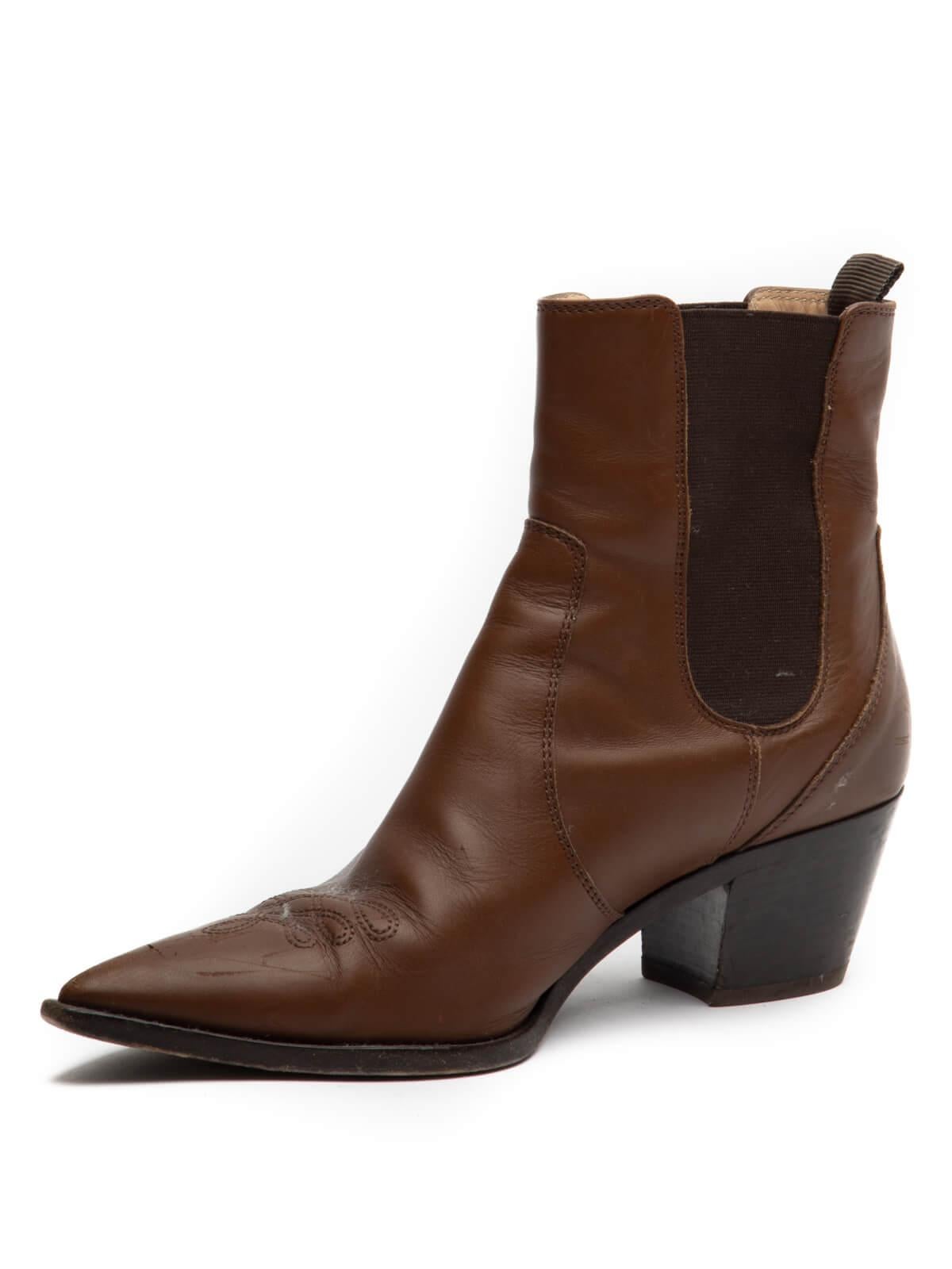 CONDITION is good. Creasing, Stains, and scuffmarks evident on leather. Wear evident on in-sole and outer sole. Wear evident on tip. Scratches on the heel. Details Brown Pointed Toe Leather Heel Made in Italy Composition Leather, Elastic Canvas