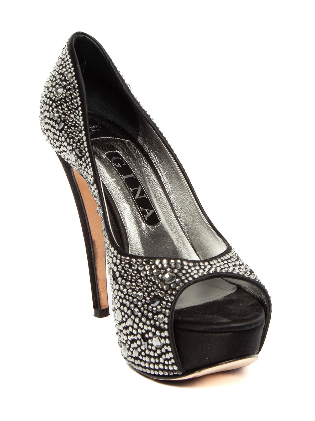 CONDITION is Good. Some wear to heels is evident. Creases to interior leather, and wear to outer sole on this used Gina designer resale item. Details Black/Silver Satin/ leather Platform Peep toe Crystals embellished on satin Stiletto heel Leather