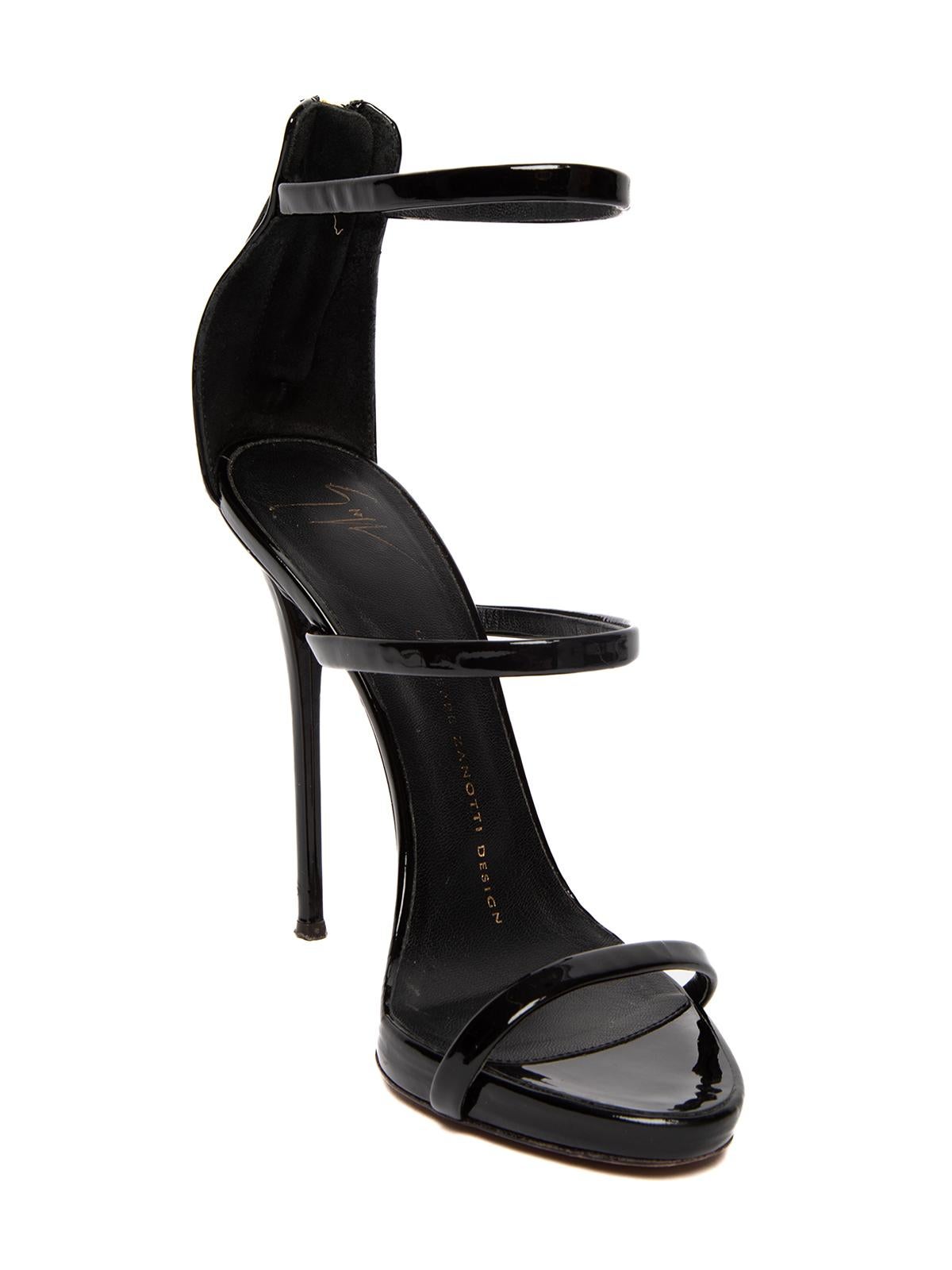 CONDITION is Good. Some wear to heels is evident. Worn out outersole and discoloration to suede on this used Giuseppe Zanotti designer resale item. Details Harmony collection Black Patent leather Strappy design Open toe Zip up fastening Stiletto