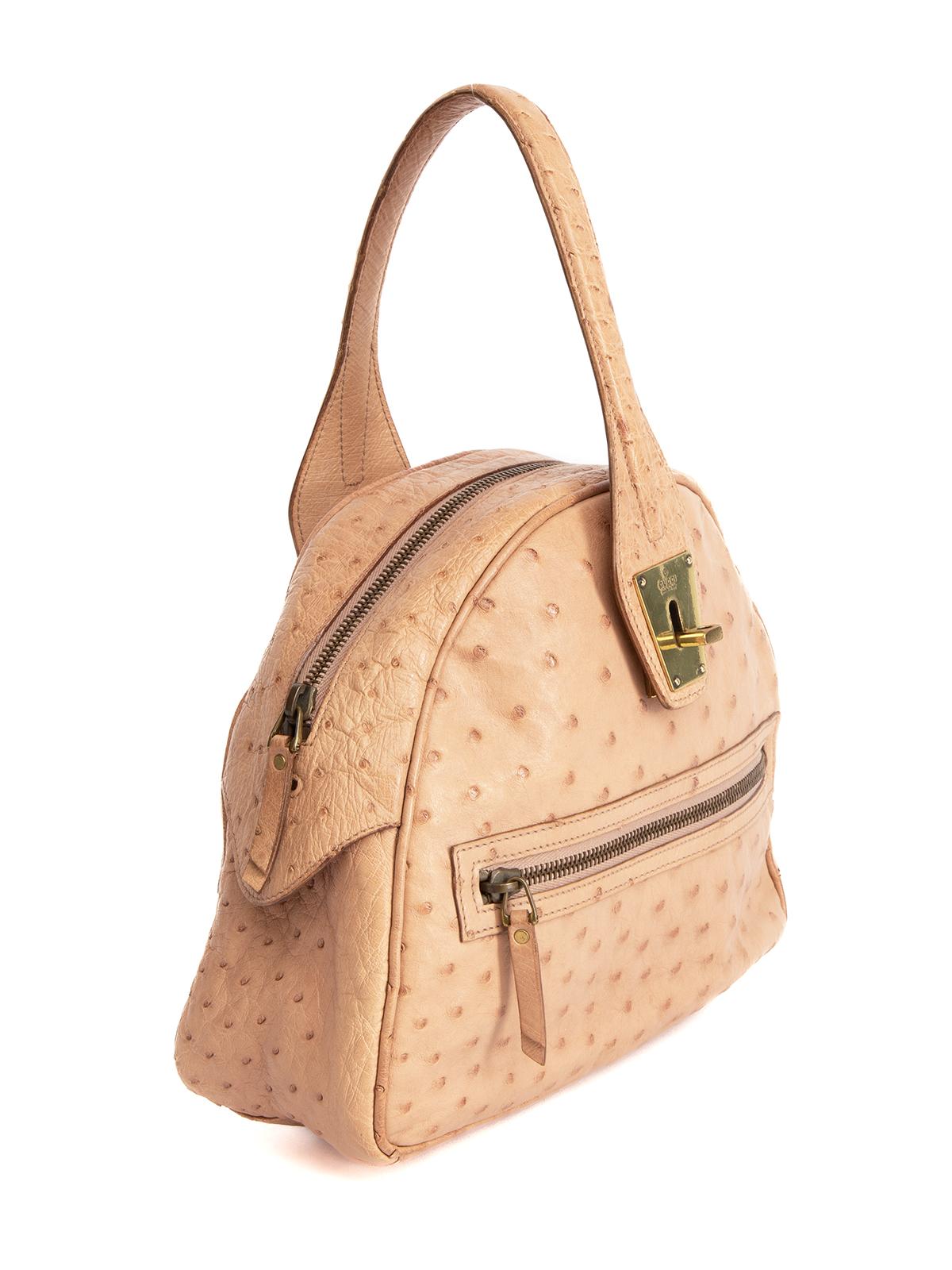 CONDITION is Very good. Minimal wear to bag is evident. Minimal wear to Leather exterior and gold hardware on this used Gucci designer resale item. Details Brown, beige Leather Top handle bag Single handle Gold tone hardware Turn lock fastening