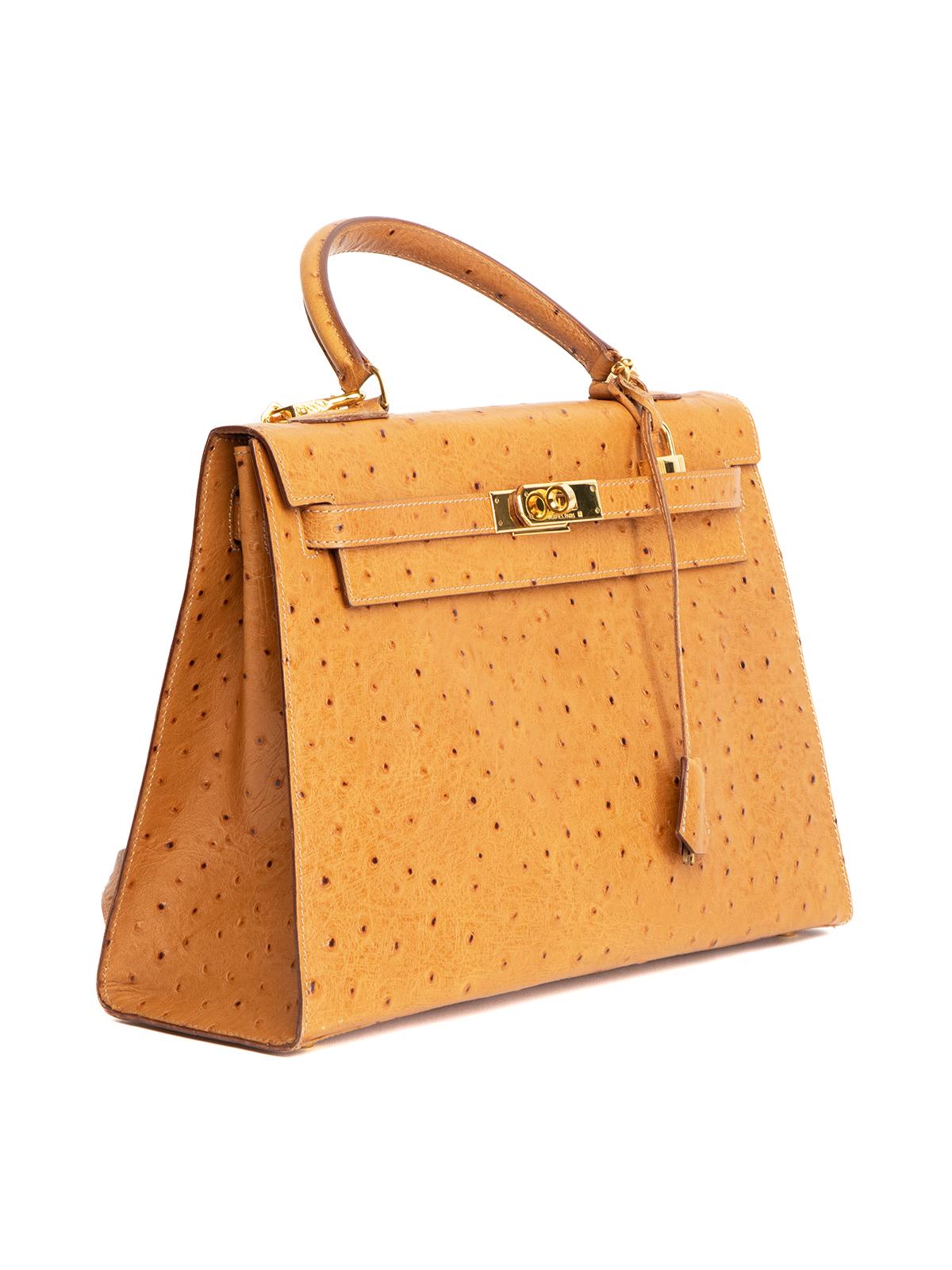 CONDITION is Very good. Minimal wear to bag is evident. Minimal wear to interior of bag on this used Hermes designer resale item. Details Colour - beige/brown Material - ostrich leather Handles x 2 Hardware - gold tone metal Fastening - turn lock