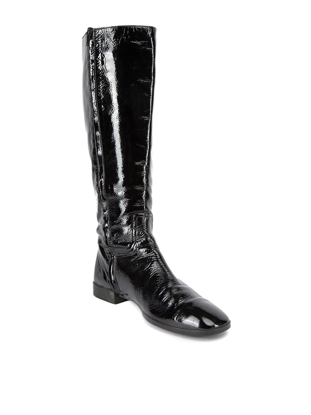 CONDITION is Very good. Hardly any visible wear to shoes is evident. Some creasing can be seen to patent leather exterior and there is vey light wear to the soles on this used Hogan designer resale item. Details Black Patent leather Knee high boots