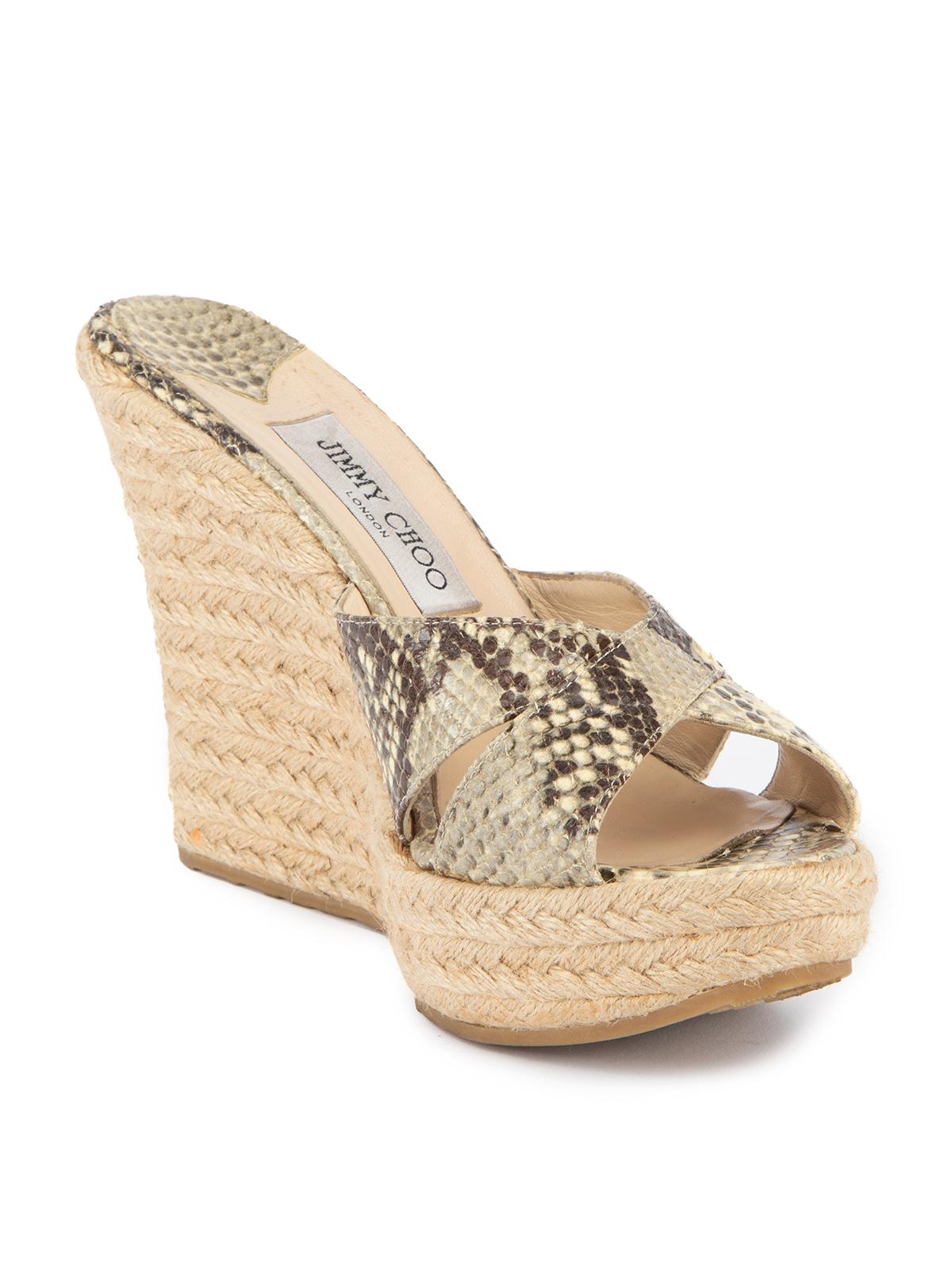 CONDITION is Very good. Minimal wear to shoes is evident on this used Jimmy Choo designer resale item. This item comes with original box. Details Grey Exotic leather Slip on espadrille Peep almond toe Wedge platform heel Snakeskin Crossover straps