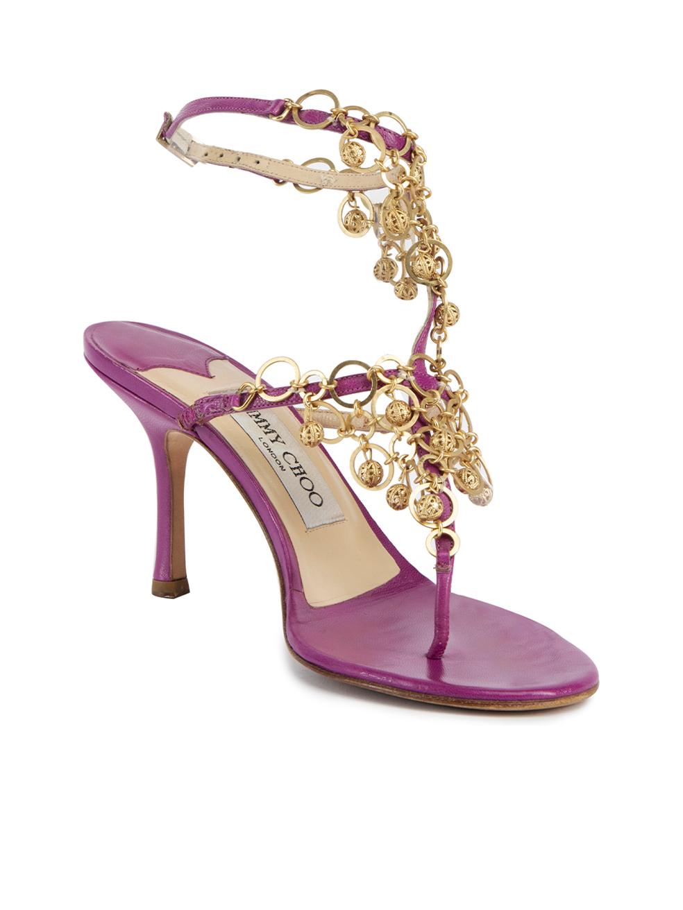 CONDITION is Very good. Hardly any visible wear to heel is evident. Slight marks to both heels can be seen on this used Jimmy choo designer resale item. Details Purple Leather Thong sandals Mid heel Ankle strap closure Gold tone circle charms accent