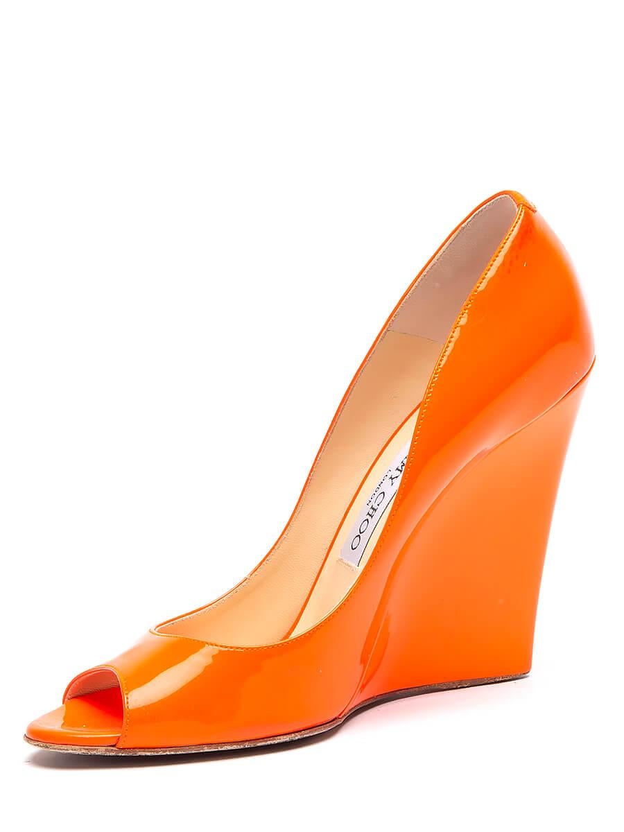 Condition is good, minor stains on the patent leather, wear and slight damage evident on the outer sole. Designer Fit: Jimmy Choo wedges typically run a half size small. Heel Height: 12CM / 4. 7