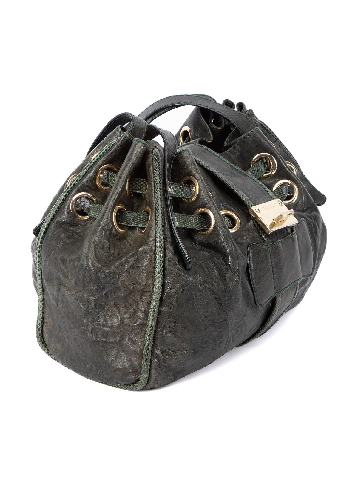 CONDITION is Good. Minor wear to bag is evident. The leather exterior and bag handle is worn and faded in some places. There is also natural creasing to the bag from use on this used Jimmy Choo designer resale item. This item comes with the original