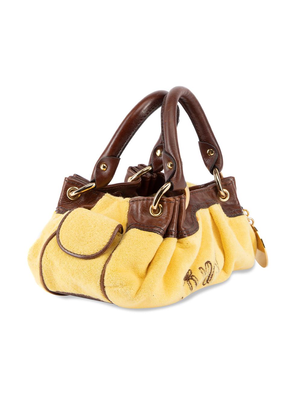 CONDITION is Very good. Minimal wear to bag is evident. Minimal wear to the exterior towelling faabric wheee stains and scuffs to the leather bag handles can be seen on this used Juicy Couture designer resale item. Details Yellow and brown Cotton