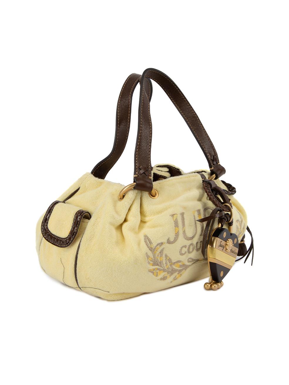 CONDITION is Very good. Hardly any visible wear to bag is evident. Small marks can be seen on the heart decorative item on this used Juicy Cotoure designer resale item. Details Yellow and brown Velvet and faux leather Medium shoulder bag Juicy
