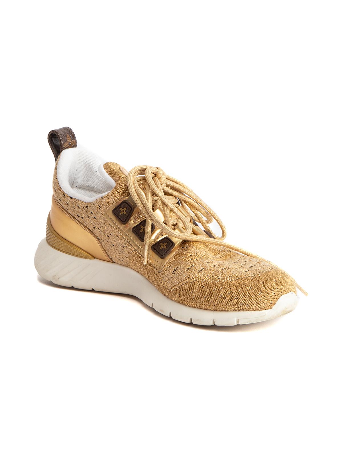 CONDITION is Very good. Minimal wear to sneakers is evident. Minimal wear to midsole and outsole on this used Louis Vuitton designer resale item Details Gold Cloth Round toe Lace fastenings Leather accents Rubber sole Made in Italy Composition