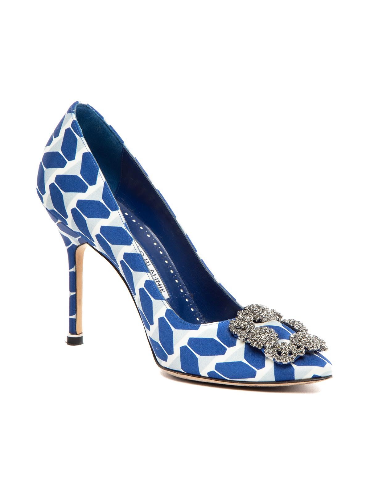 CONDITION is Very good. Minimal wear to heels is evident. Minimal wear to outsole and heel point on this used Manolo Blahnik designer resale item. Details: Hangisi Blue/ White Satin Stiletto Almond toe Embellished accessory on front Leather insoles