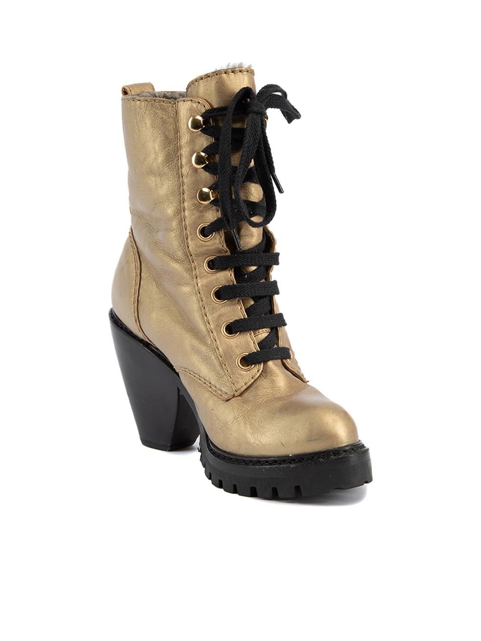 CONDITION is Very good. Hardly any wear to heels is evident. Some watermarks can be seen to leather aterial on heels and there is creasing the leather material on this used Marc Jacobs designer resale item. Details Gold Leather Lace up boots