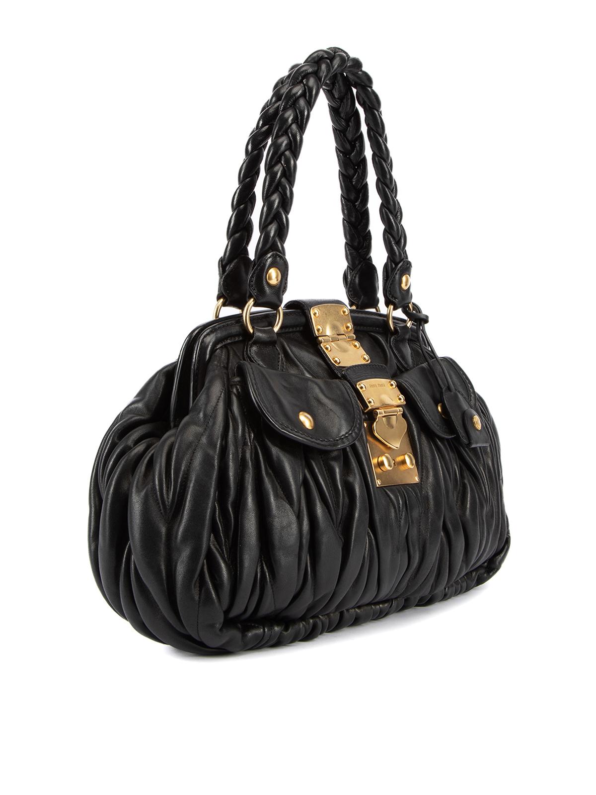 CONDITION is Very good. Minimal wear to bag is evident. Minimal wear to the leather exterior and the gold hardware which is a little faded/scuffed on this used Miu Miu designer resale item. This item comes with the original dustbag. Details Black