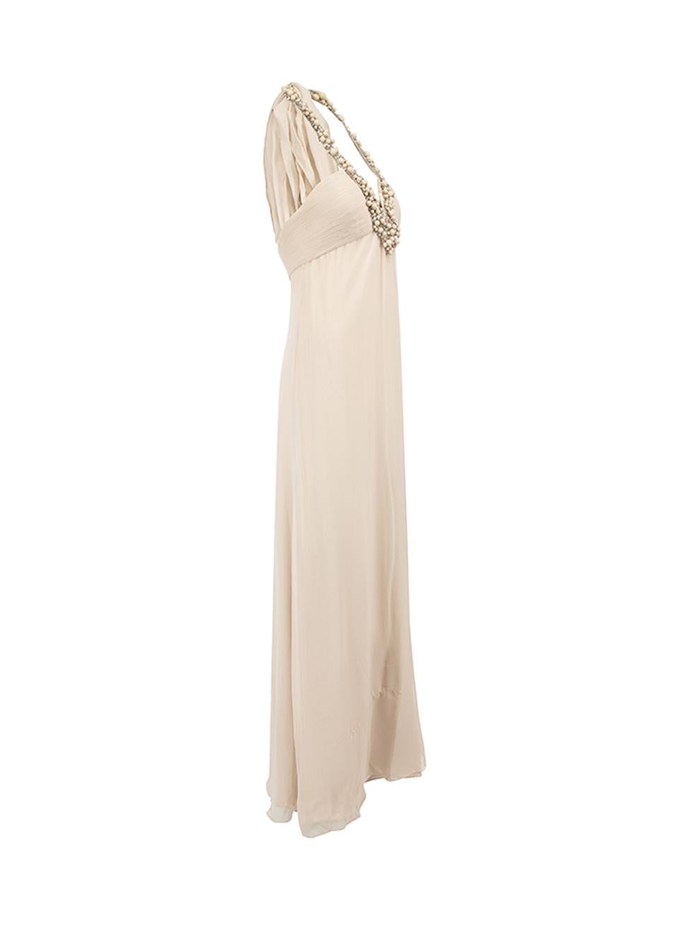 CONDITION is Very good. Minimal wear to dress is evident. Minimal wear and loose threads around the beaded neckline on this used Monique Lhuillier designer resale item. Details Beige Silk Gown Loose fit Sleeveless Halterneck Beaded neckline and