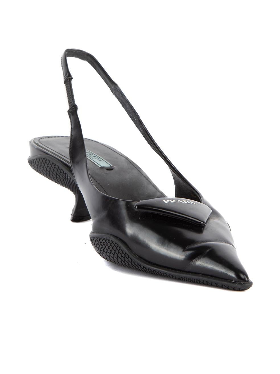 CONDITION is Very good. Minimal wear to pumps is evident. Minimal wear to the toe point where creasing to the leather can be seen on this used Prada designer resale item. Details Black Leather Pointed toe slingback Kitten heel Padded iconic triangle