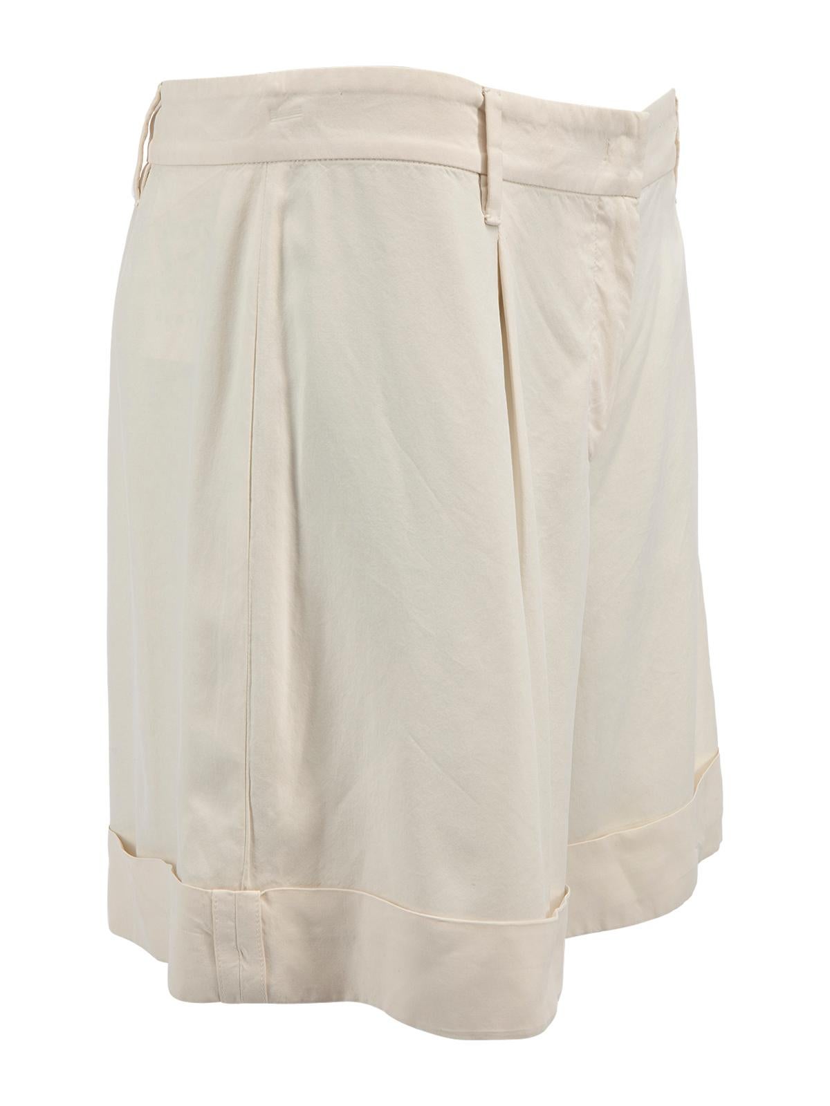 CONDITION is Very good. Hardly any visible wear to shorts is evident. A hardly visible stain to the waist band and a loose thread around the crotch area can be seen on this used Prada designer resale item. Details Cream Silk Shorts Mid rise Wide leg