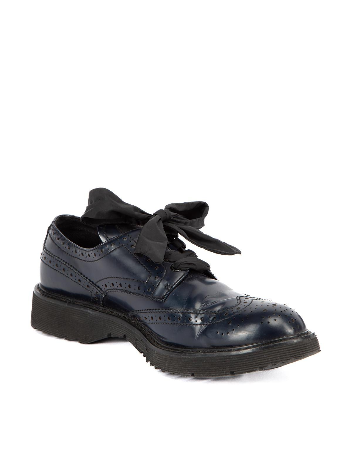 CONDITION is Very good. Minimum wear to shoes is evident. There is some creasing to the leather exterior and very light wear to the soles on this used Prada designer resale item. This item comes with the original dust bag. Details Black Leather